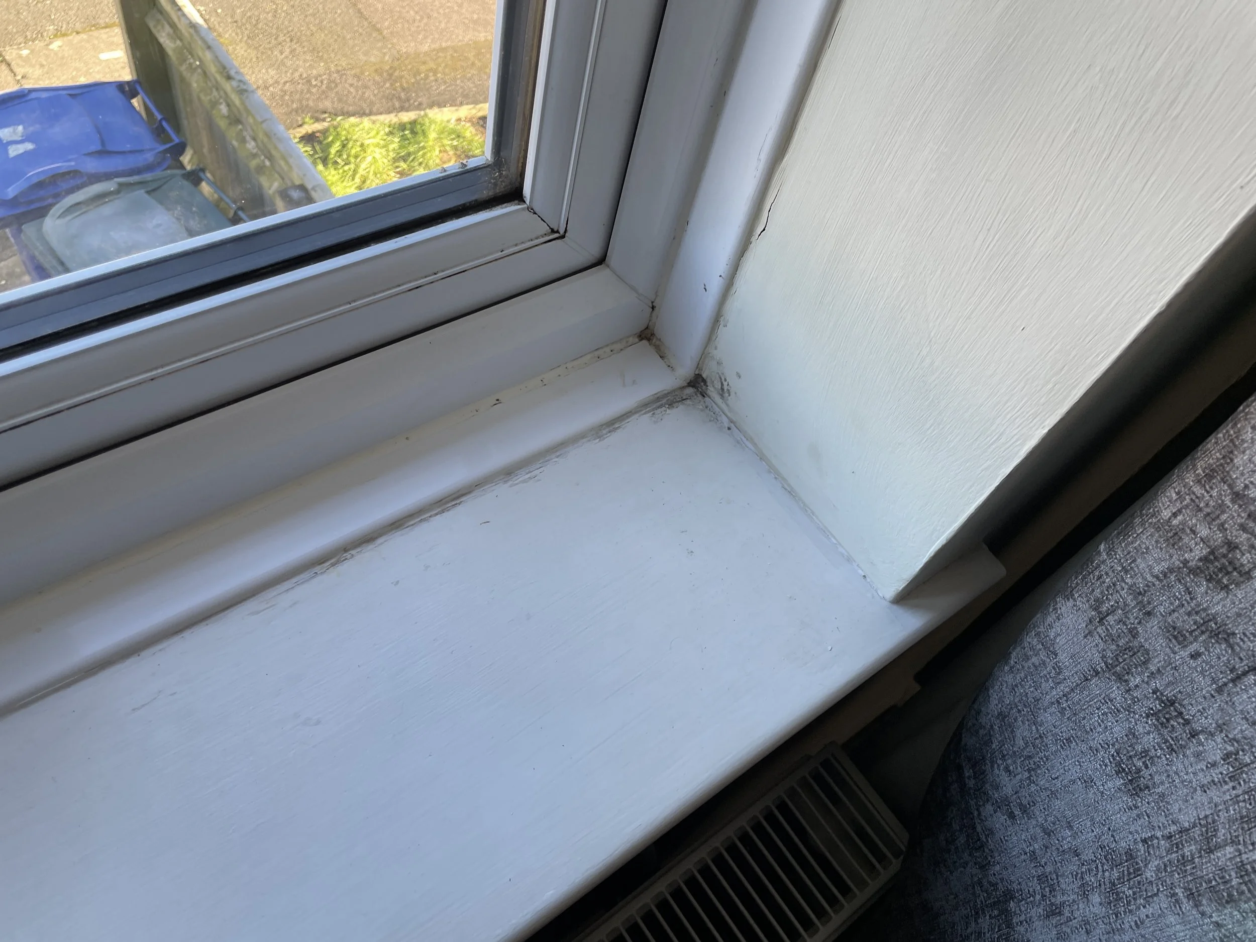 Condensation mould forming on bedroom window reveal and cill – evidence from damp and mould inspection in Milton Keynes mid-terrace property