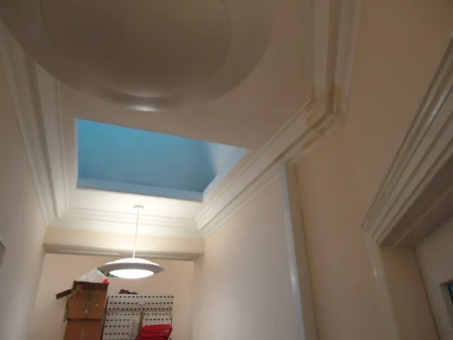 Brown staining to ceilings from leaking roof.