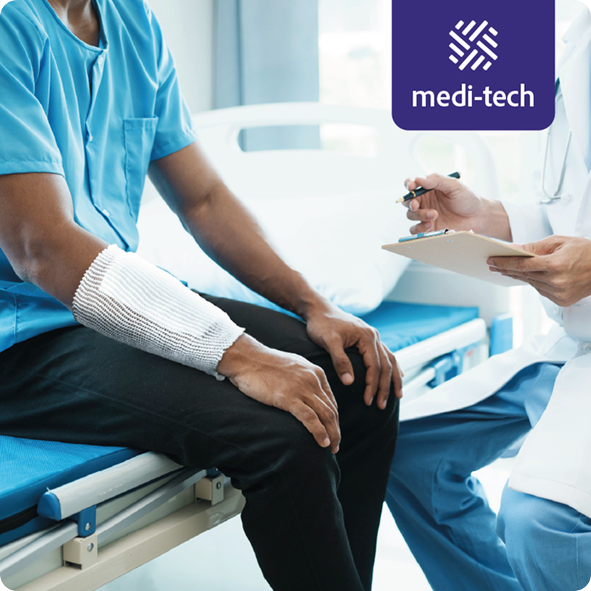 A patient wearing a hospital gown and a cast on their arm sitting on a hospital bed, talking to a doctor taking notes. The setting is a medical clinic with a 'medi-tech' logo in the top right corner.