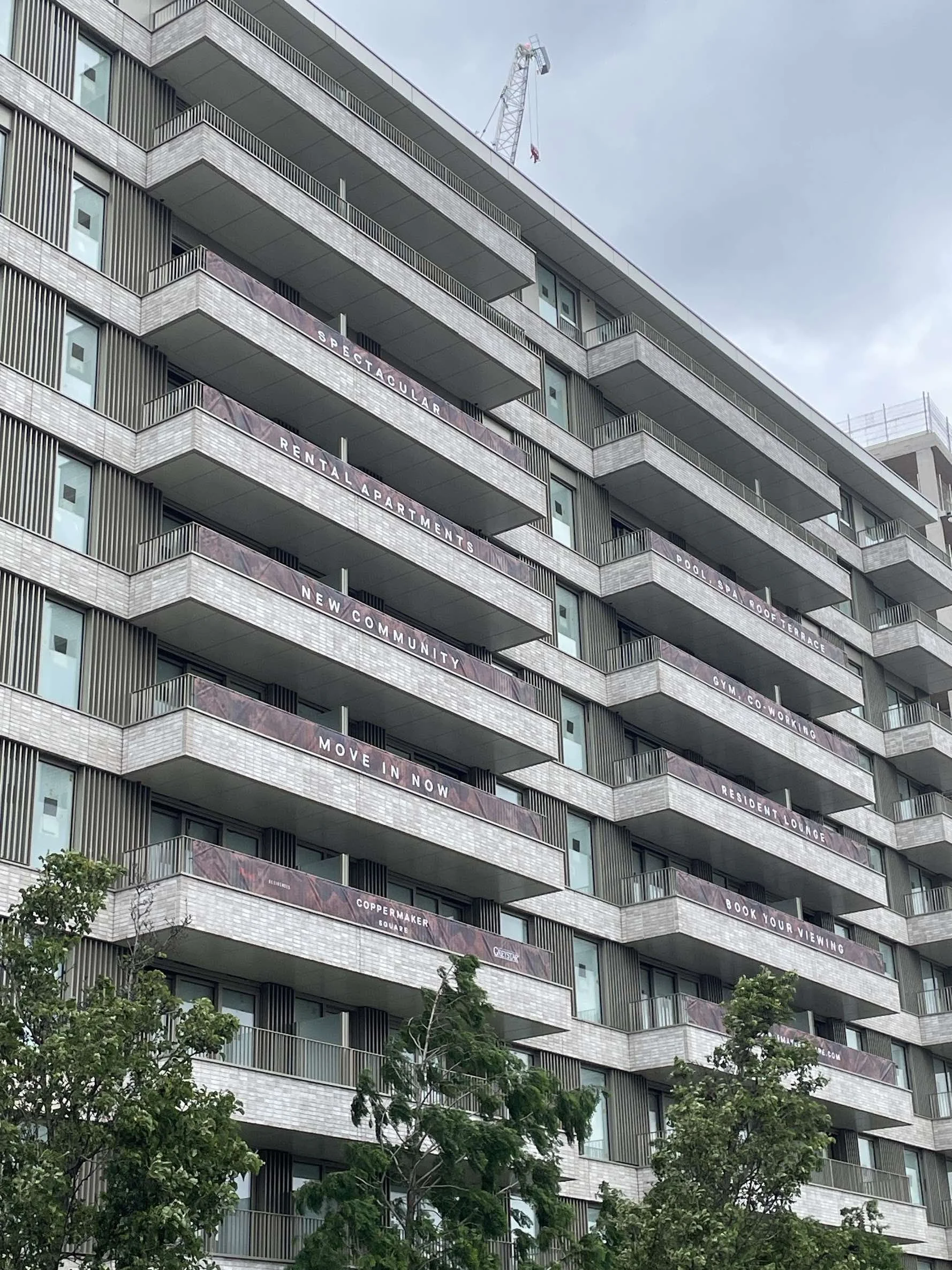 Residential Balcony Mesh Branded Signage.webp