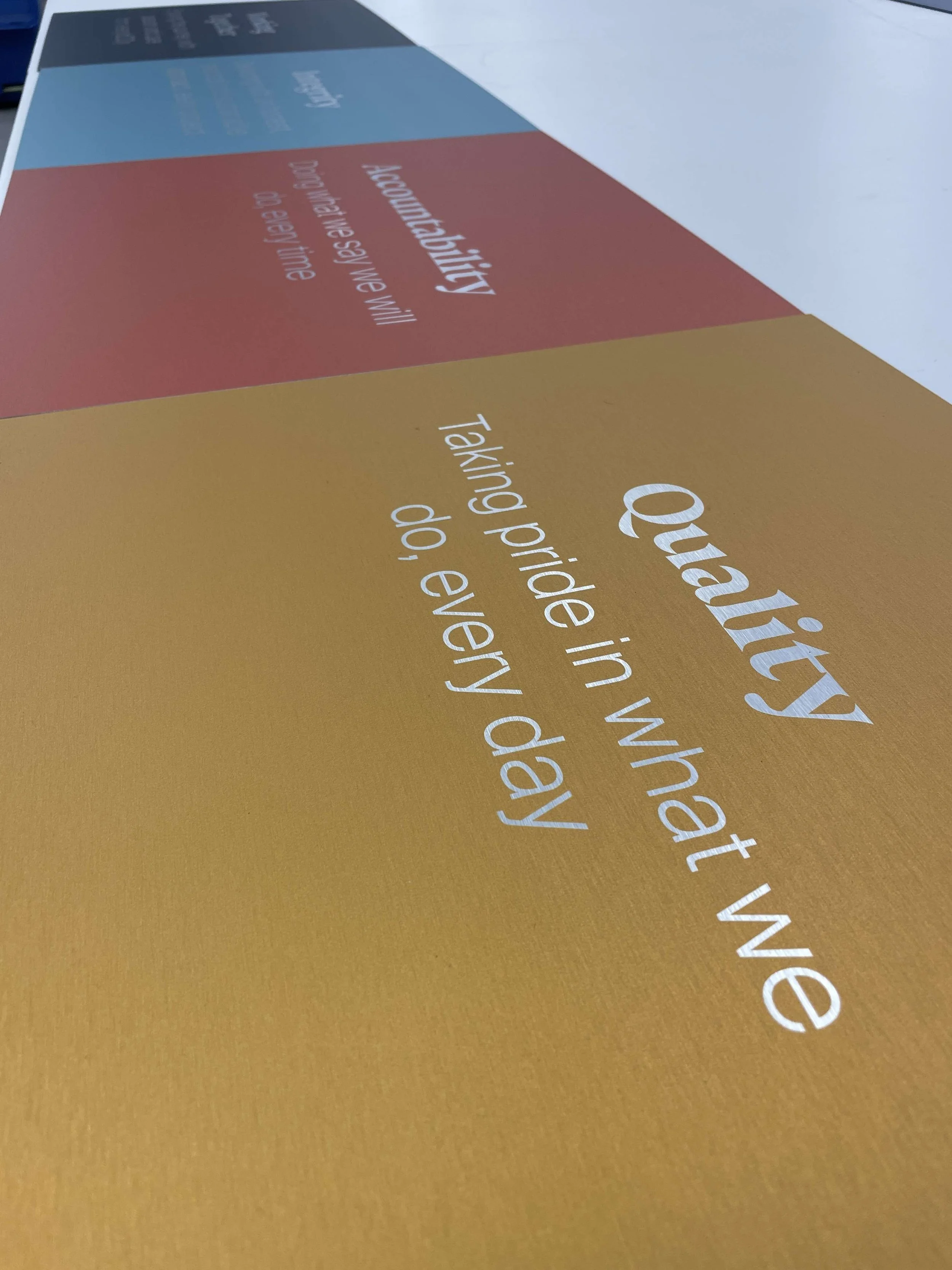 Brushed aluminium signage.webp