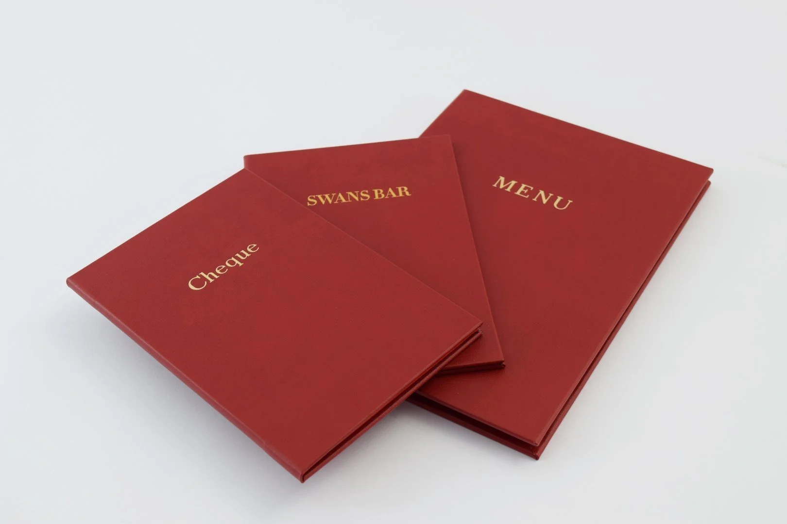 Swans Bar Maison Assouline Menu Covers Gold Foil Red Leather.webp