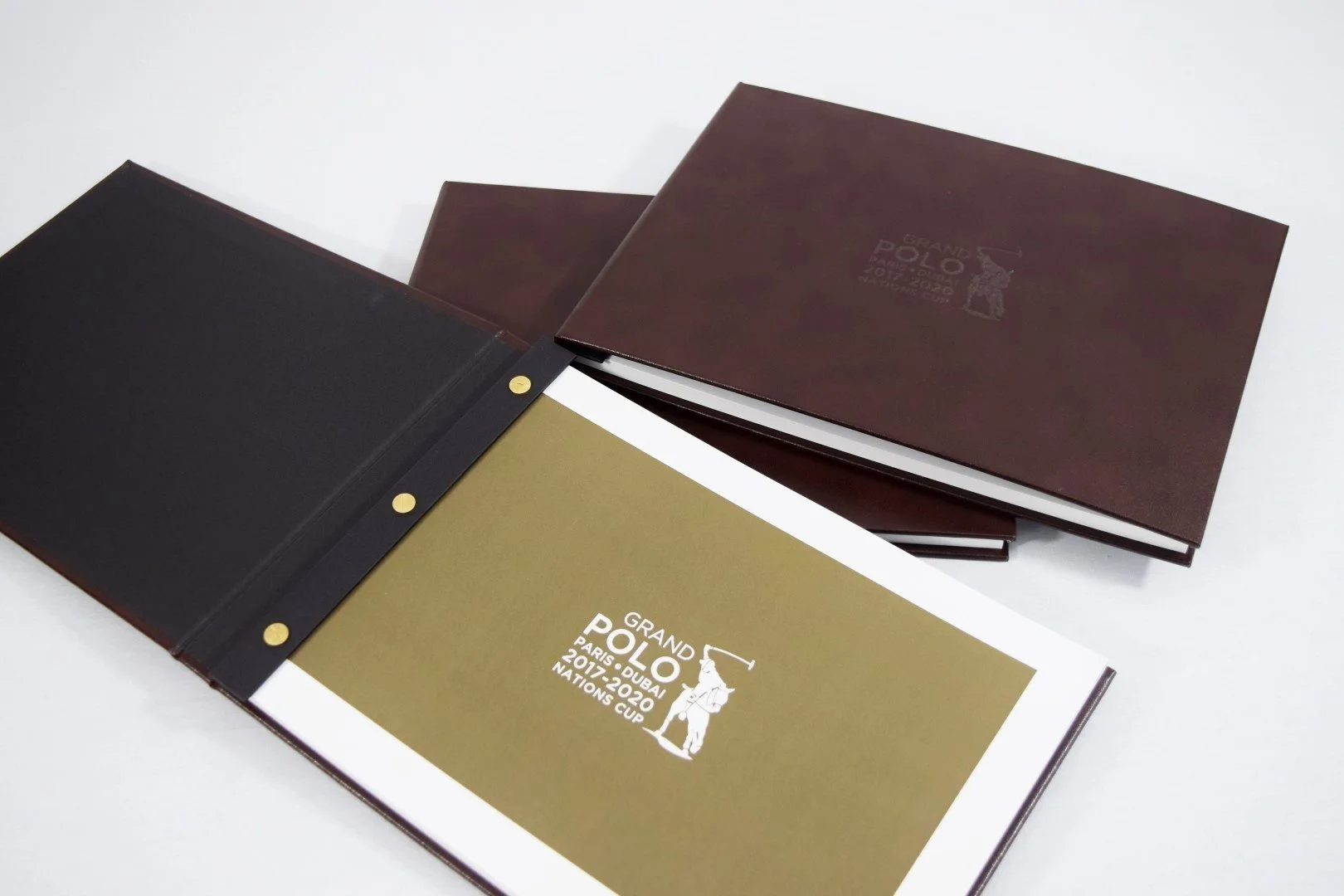 Grand Polo Paris Dubai Leather Screw Post Presentation Folder Brown Leather Gold Print.webp