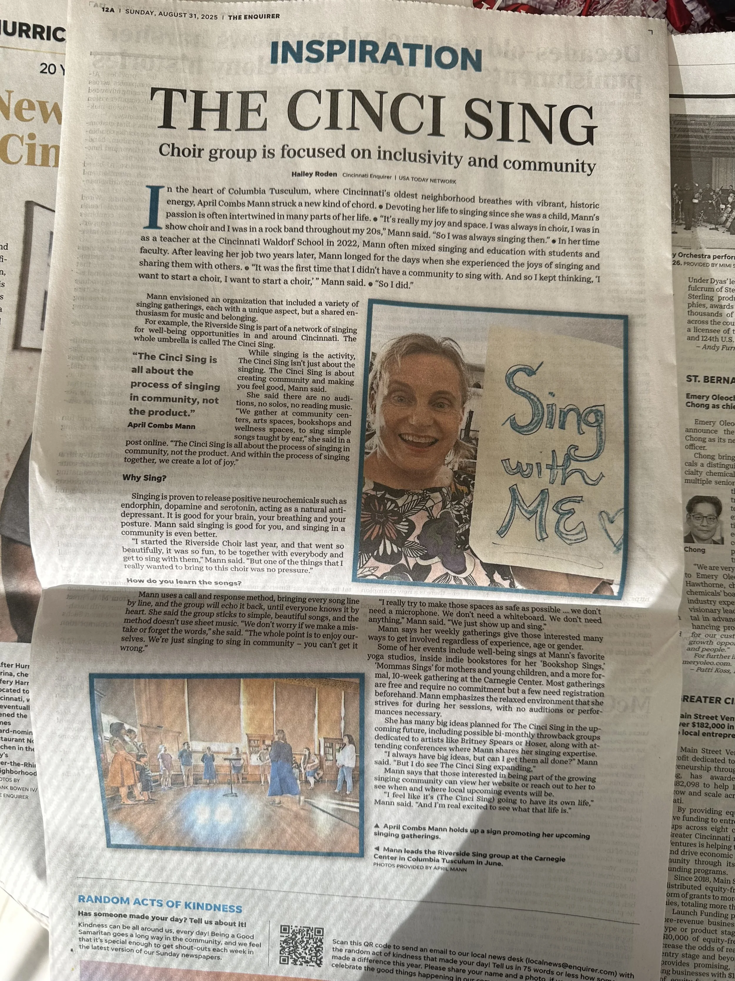 A newspaper article from The Enquirer titled 'The Cinci Sing' features a photo of a woman smiling and holding a sign that reads 'Sing with Me.' There is a picture of a dance class in a studio with people practicing on the floor.