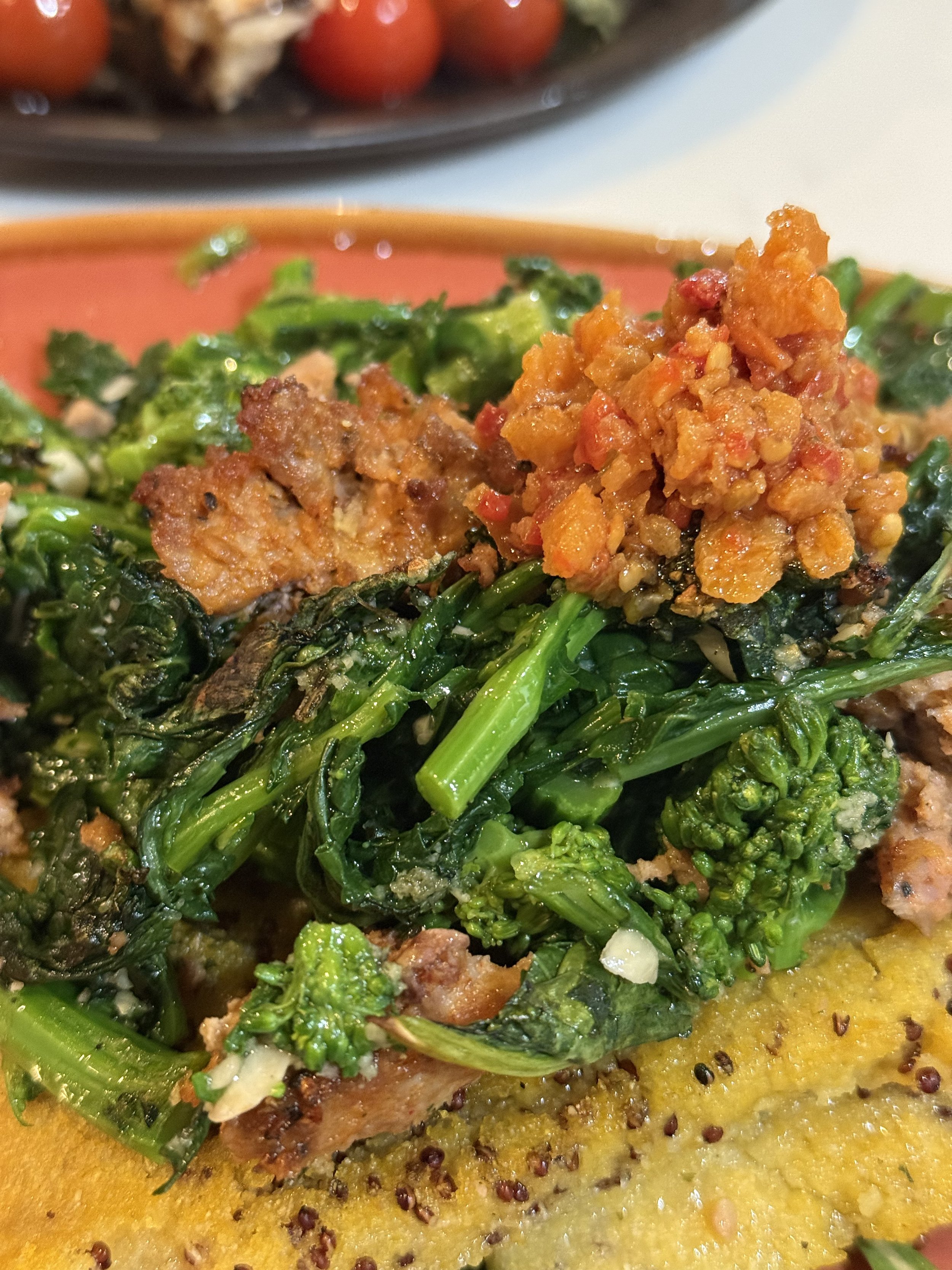 Cooked broccoli rabe with Bomba sauce on polenta
