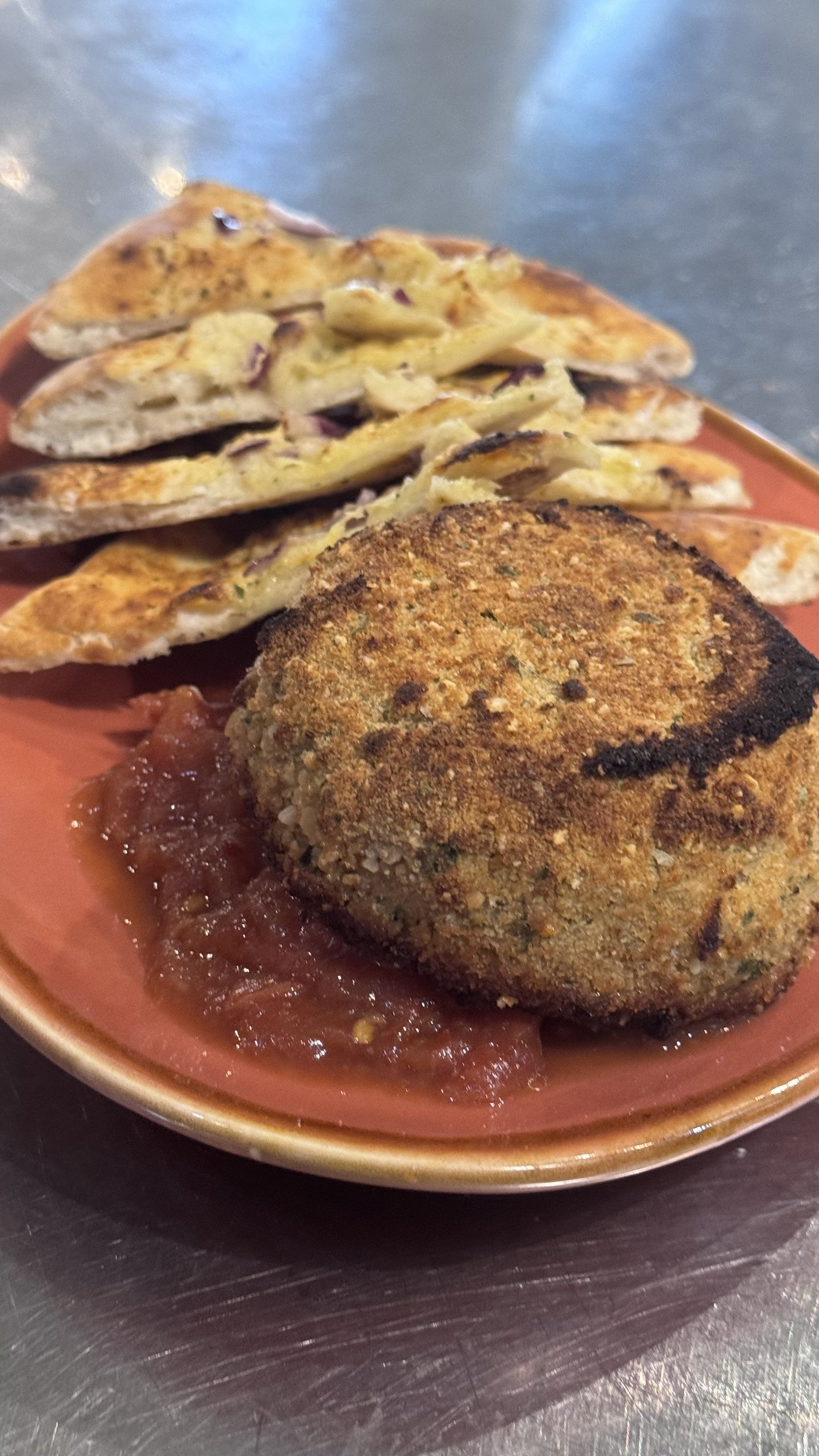 Plate with fried breaded cheese.