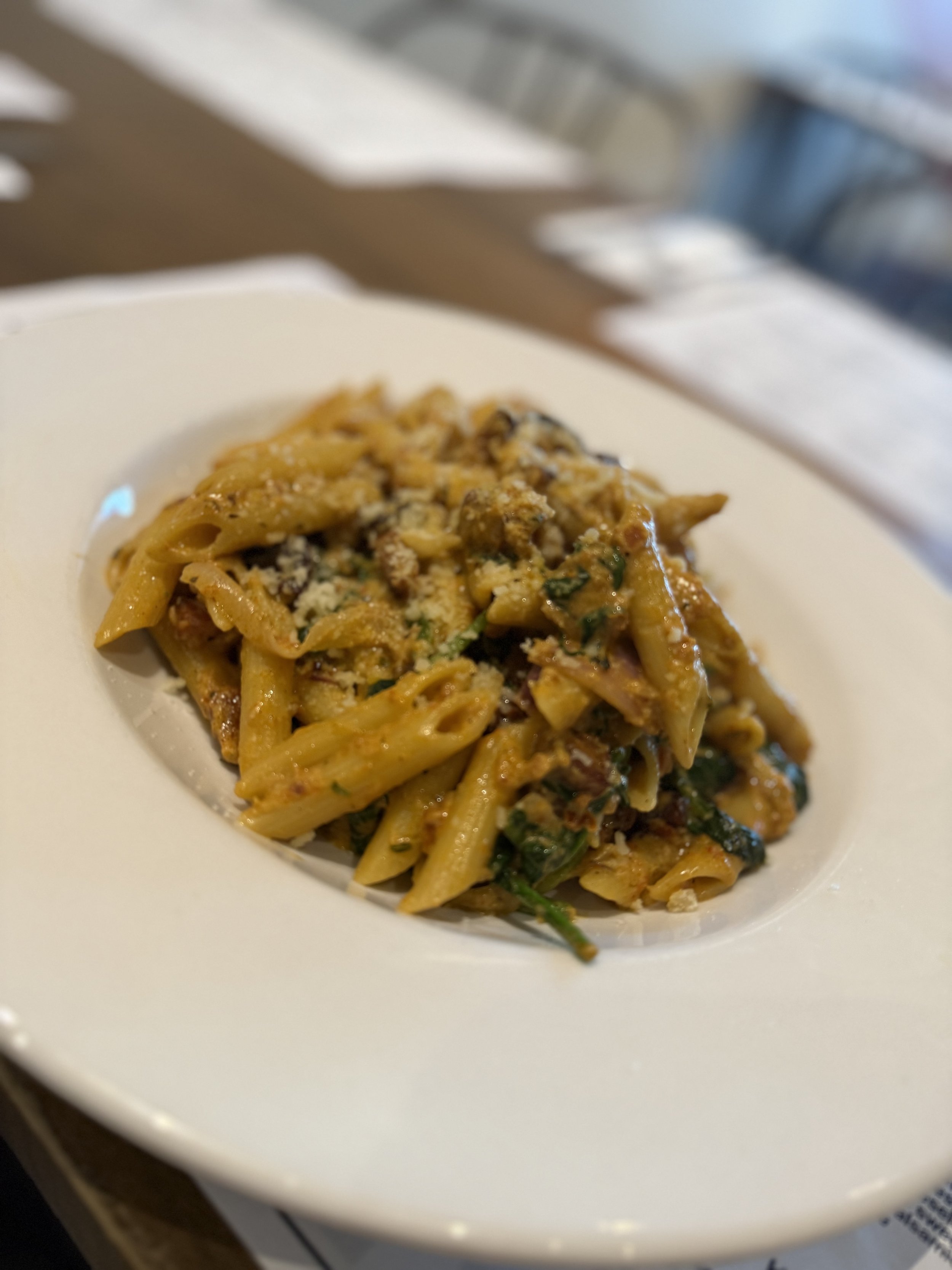 Penne pasta in a rich sun-dried tomato pesto, blended with mascarpone cheese and tender spinach.