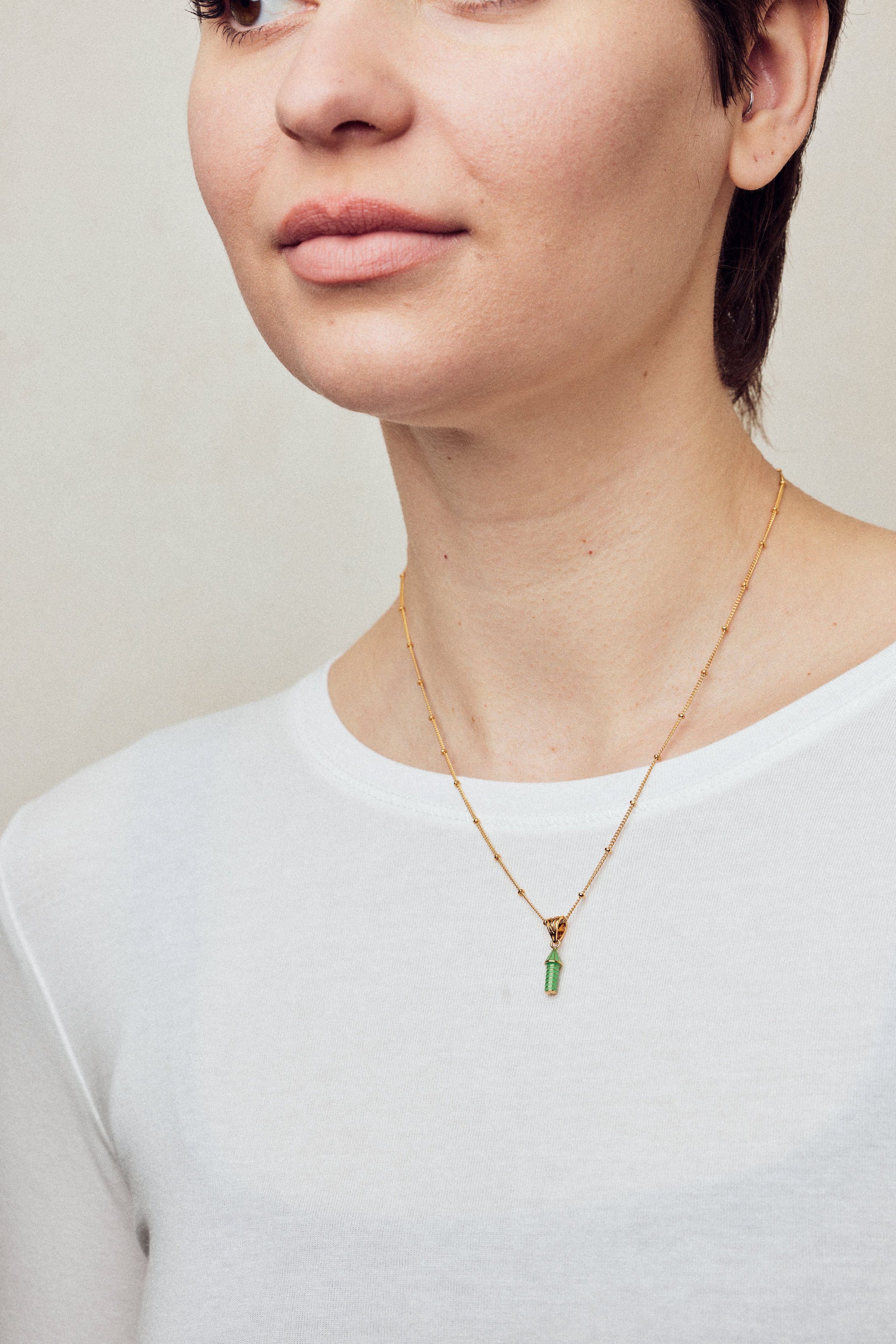 imageofenamelnecklacewithrocketonmodelinwhitetop_b3a1cae1-8ad2-472d-940b-5f4f73337193.jpg