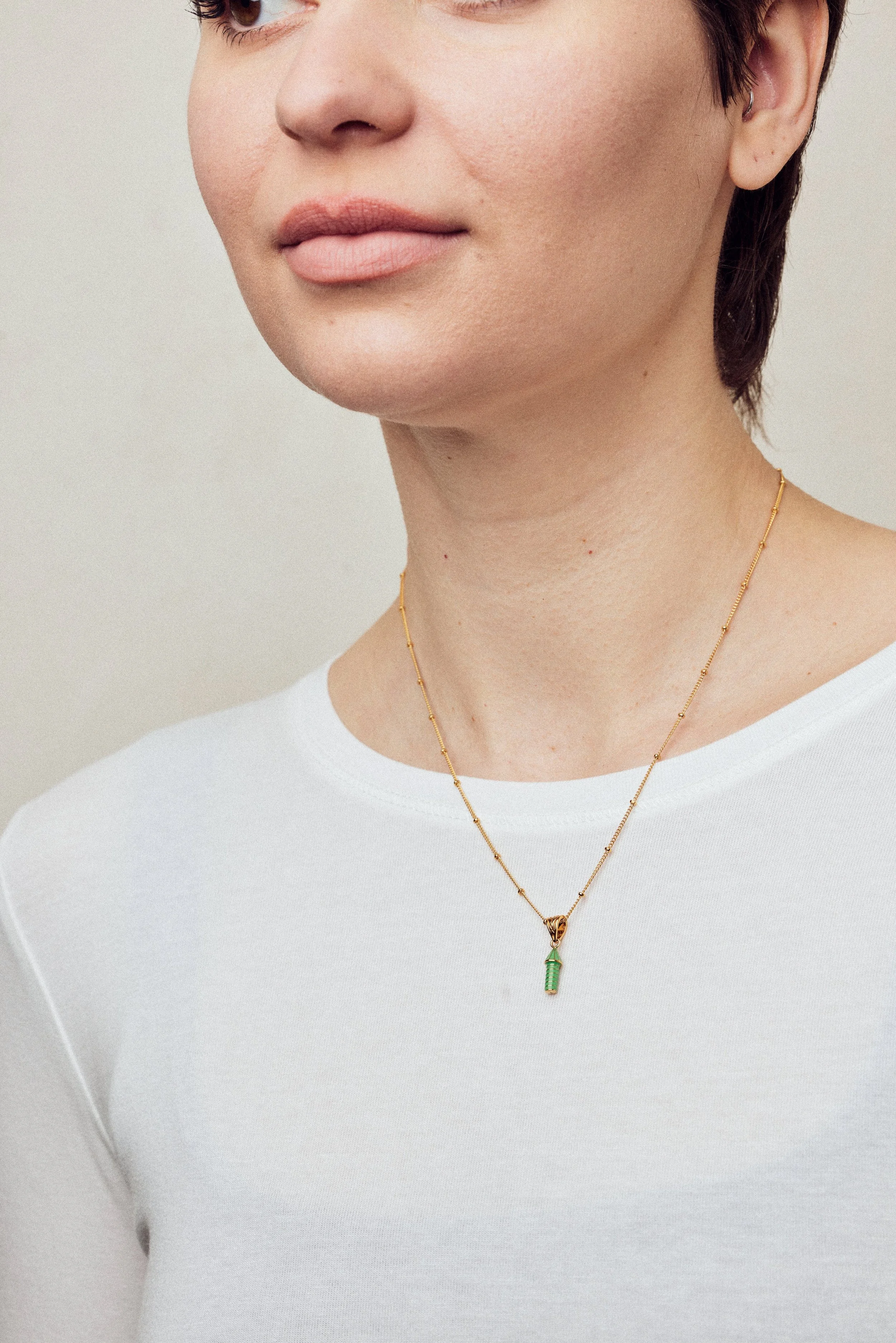 imageofenamelnecklacewithrocketonmodelinwhitetop_b3a1cae1-8ad2-472d-940b-5f4f73337193.jpg