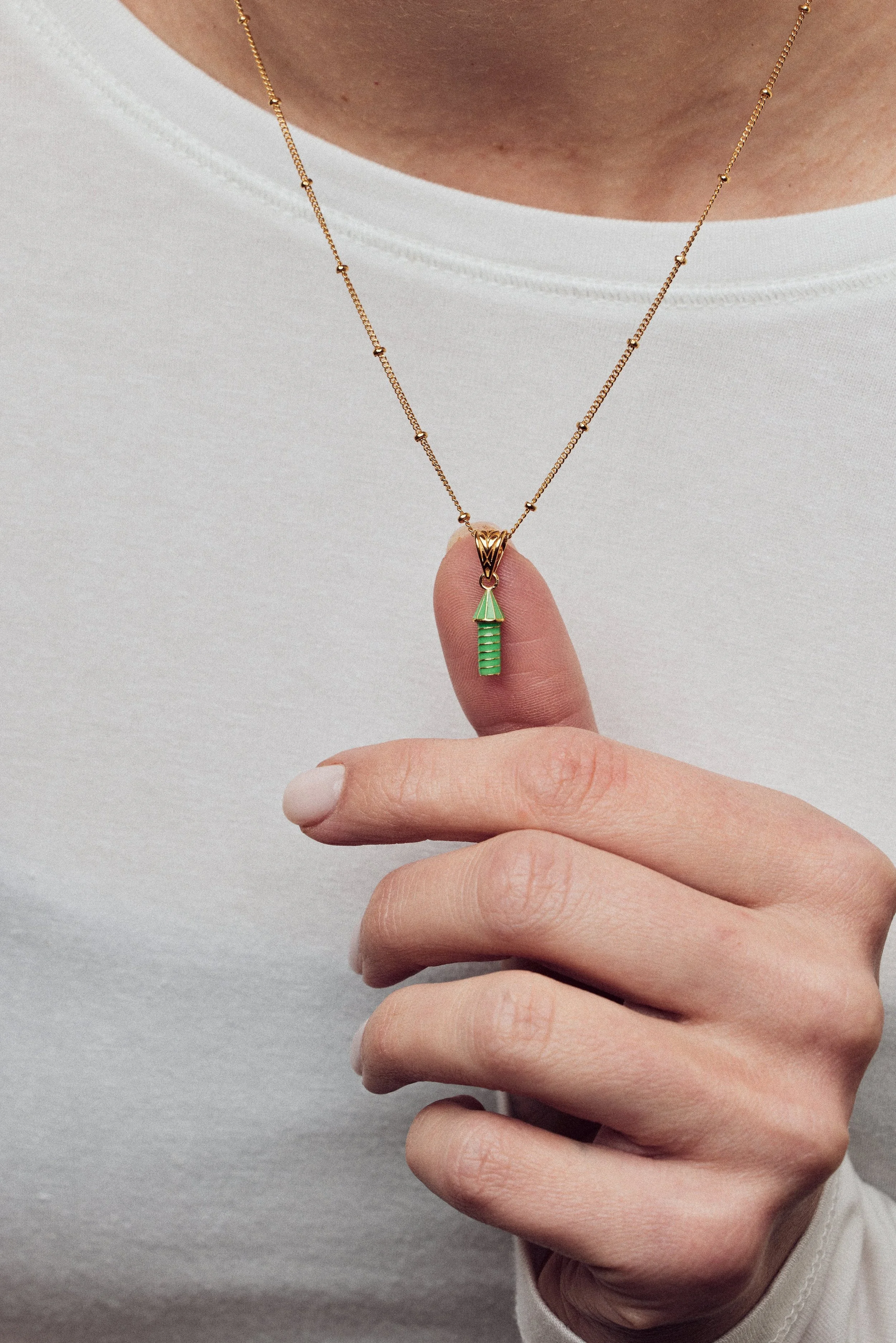imageofenamelnecklacewithgreenrocketonmodelthumbcloseup_dd75e519-7b06-4310-b566-42ad98871c5c.jpg