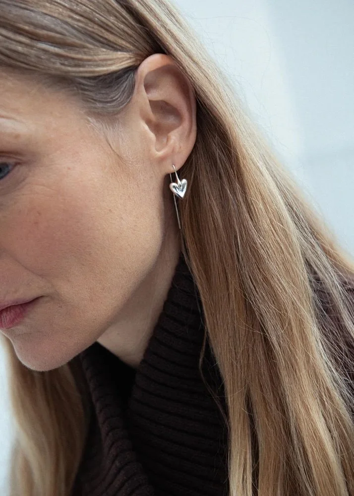 Sculptural silver heart earrings by Otiumberg worn styled.jpeg
