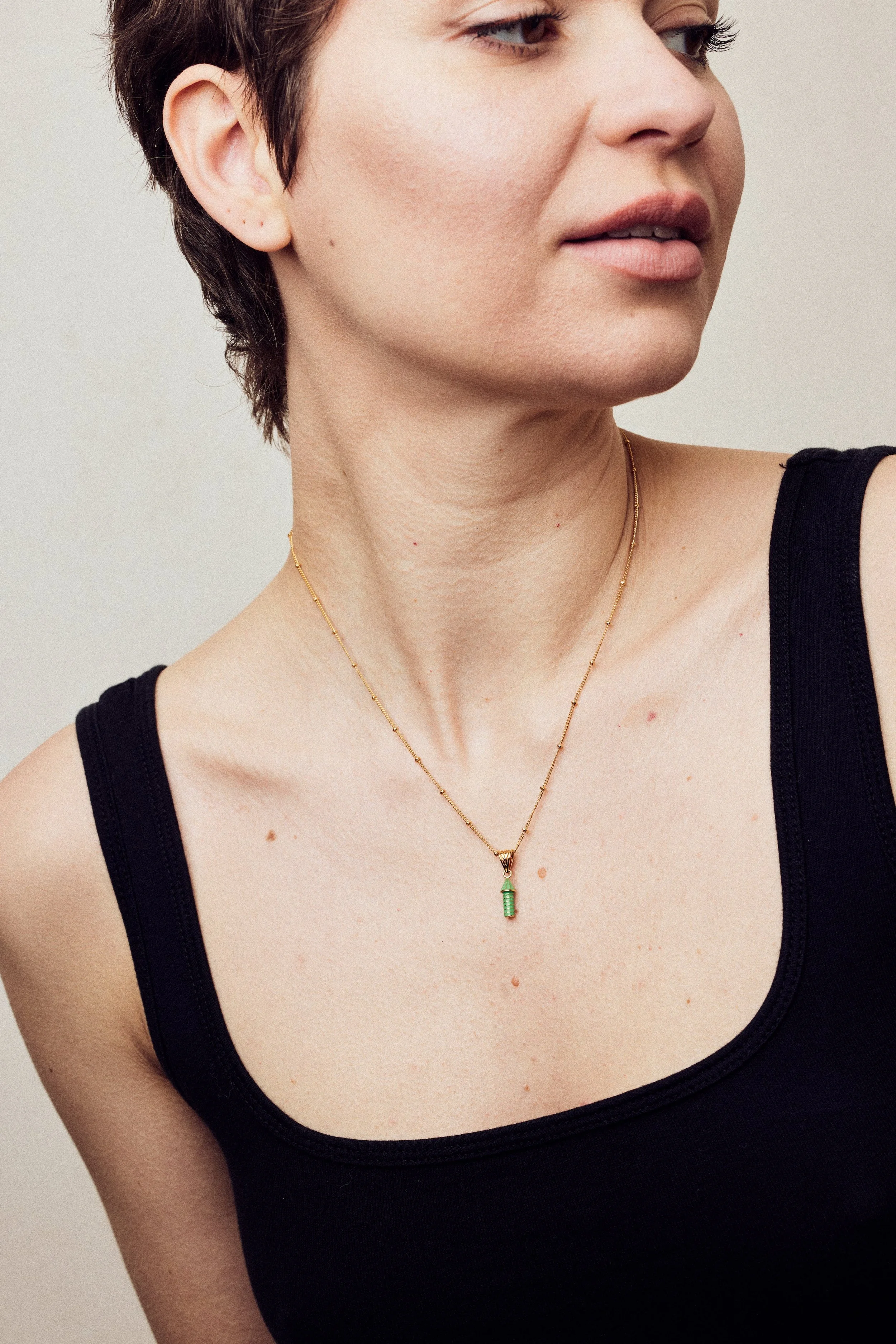imageofenamelnecklacewithrocketonmodelinblackvest_35575d93-025e-4ce5-b78b-8d59d90cc914.jpg