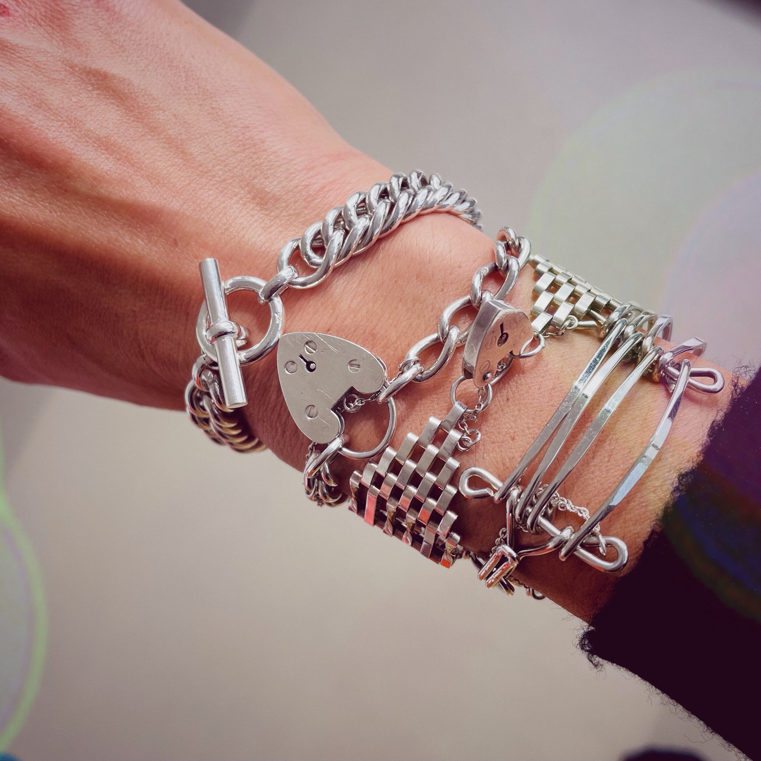 Personal silver bracelet stack with Tilly Sveaas curb chain bracelet