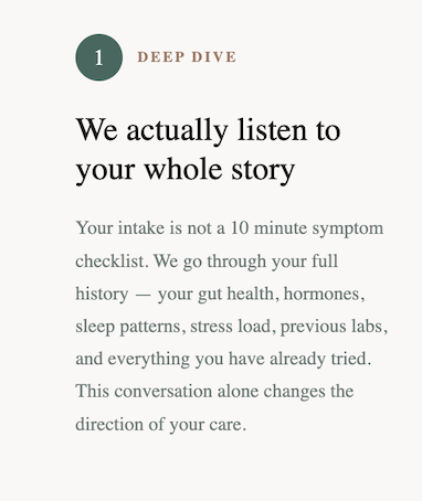 A woman sitting on a sofa using a laptop with earphones, smiling, with a cup, books, and plants around.