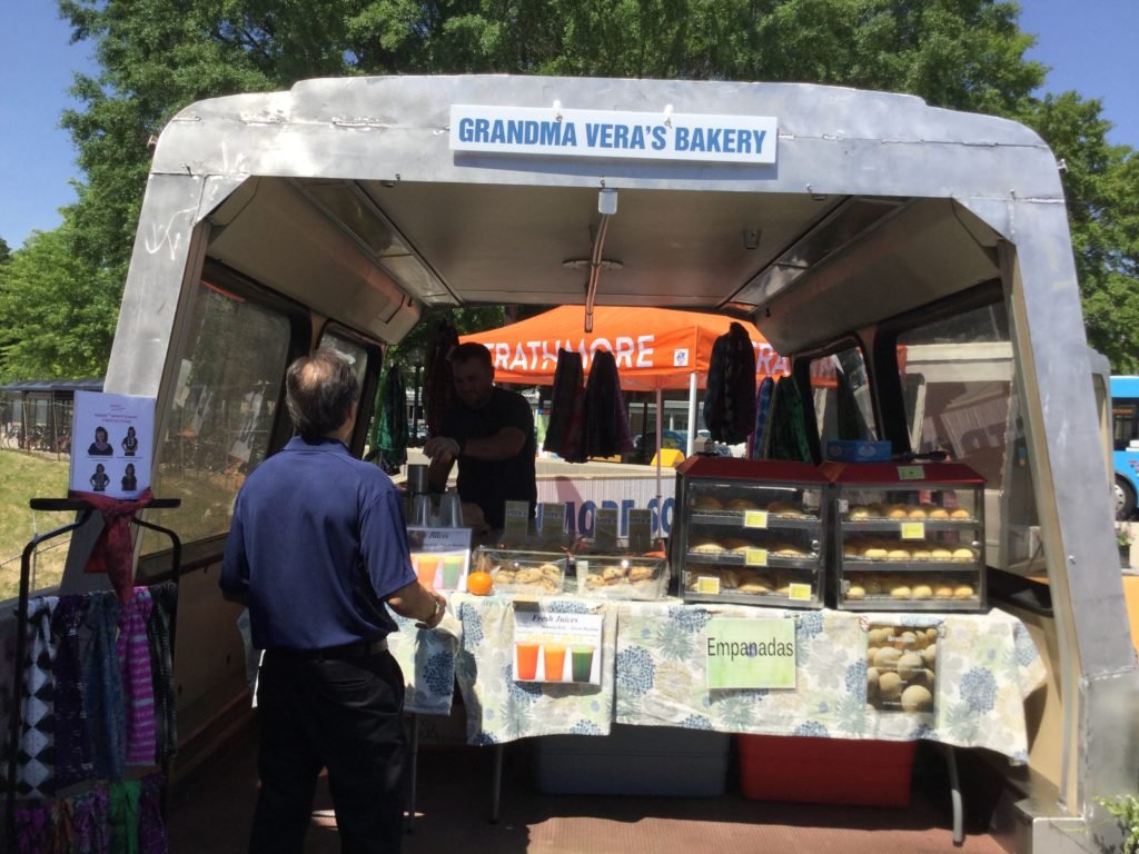 One of the shops housed in a portion of a subway car is a bakery. 