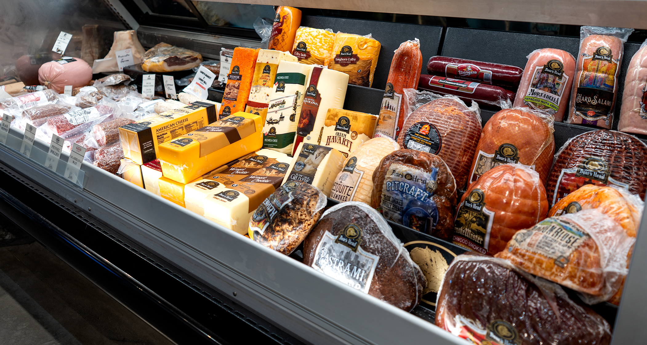 A deli case full of boar's head and charcuterie at Look's Marketplace.