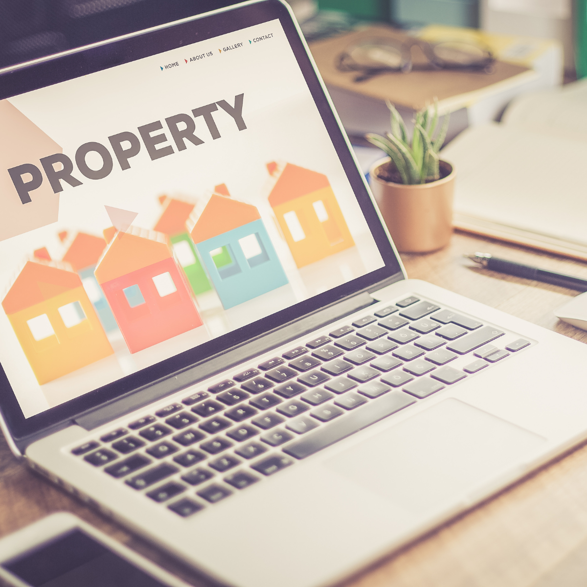 Laptop showing property listings: how a repossession affects your credit report