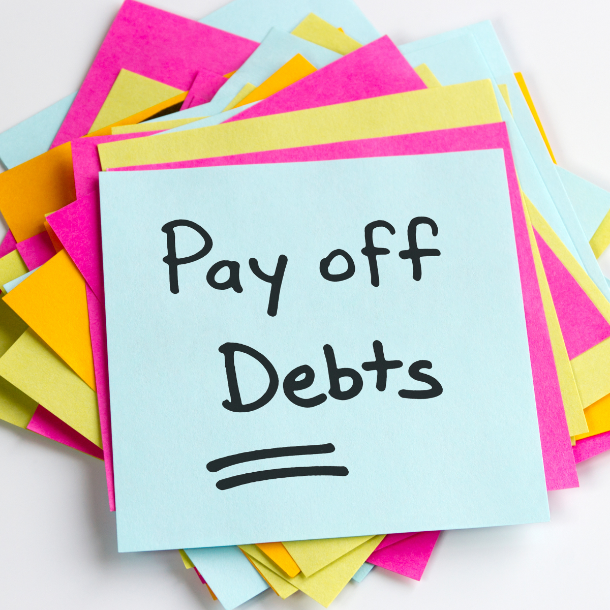 Sticky notes reading Pay off Debts: how debt settlements and short sales affect credit