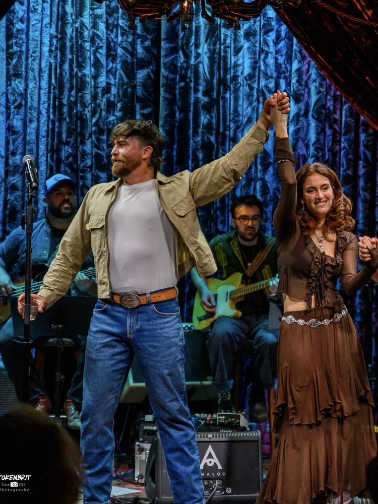 Cornelius Versa and Juliet Perel taking a bow after Oil and Whiskey