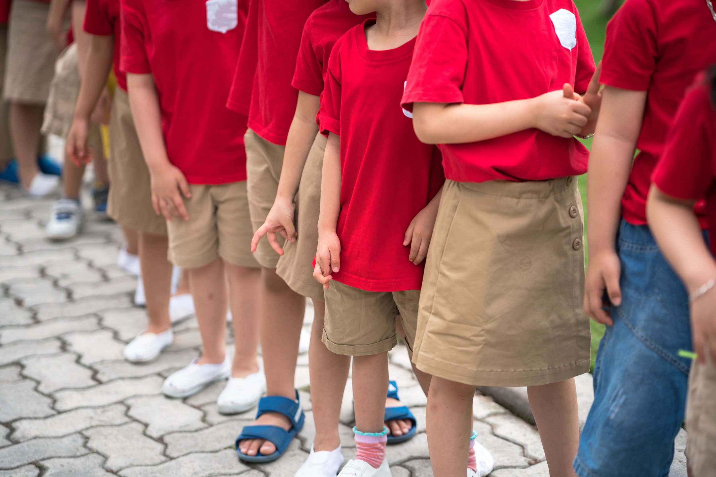 Students standing in an organized line during a school emergency preparedness or evacuation drill.