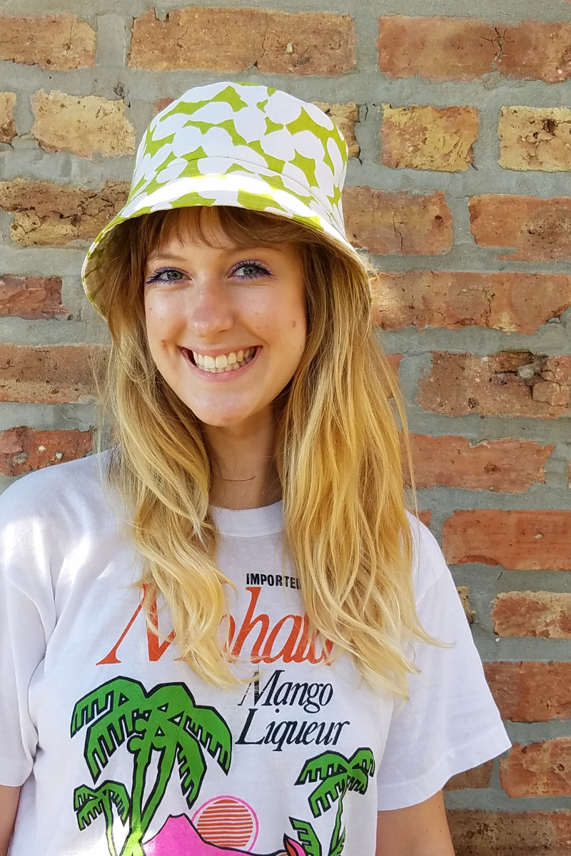 Model wearing handmade bucket hat by Tonya Gross Millinery.