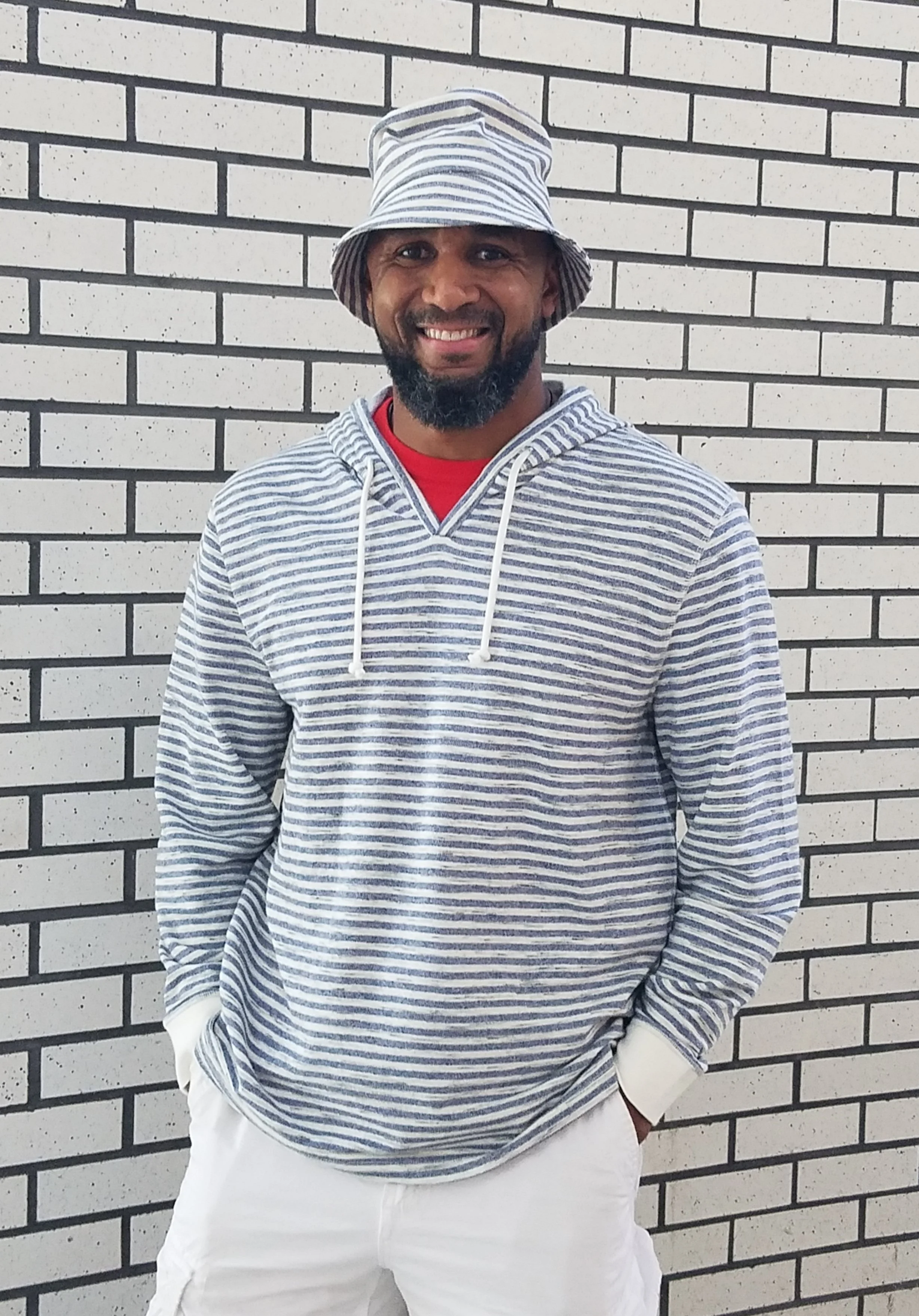 Model wearing elevated bucket hat created and hand made by Tonya Gross Millinery.
