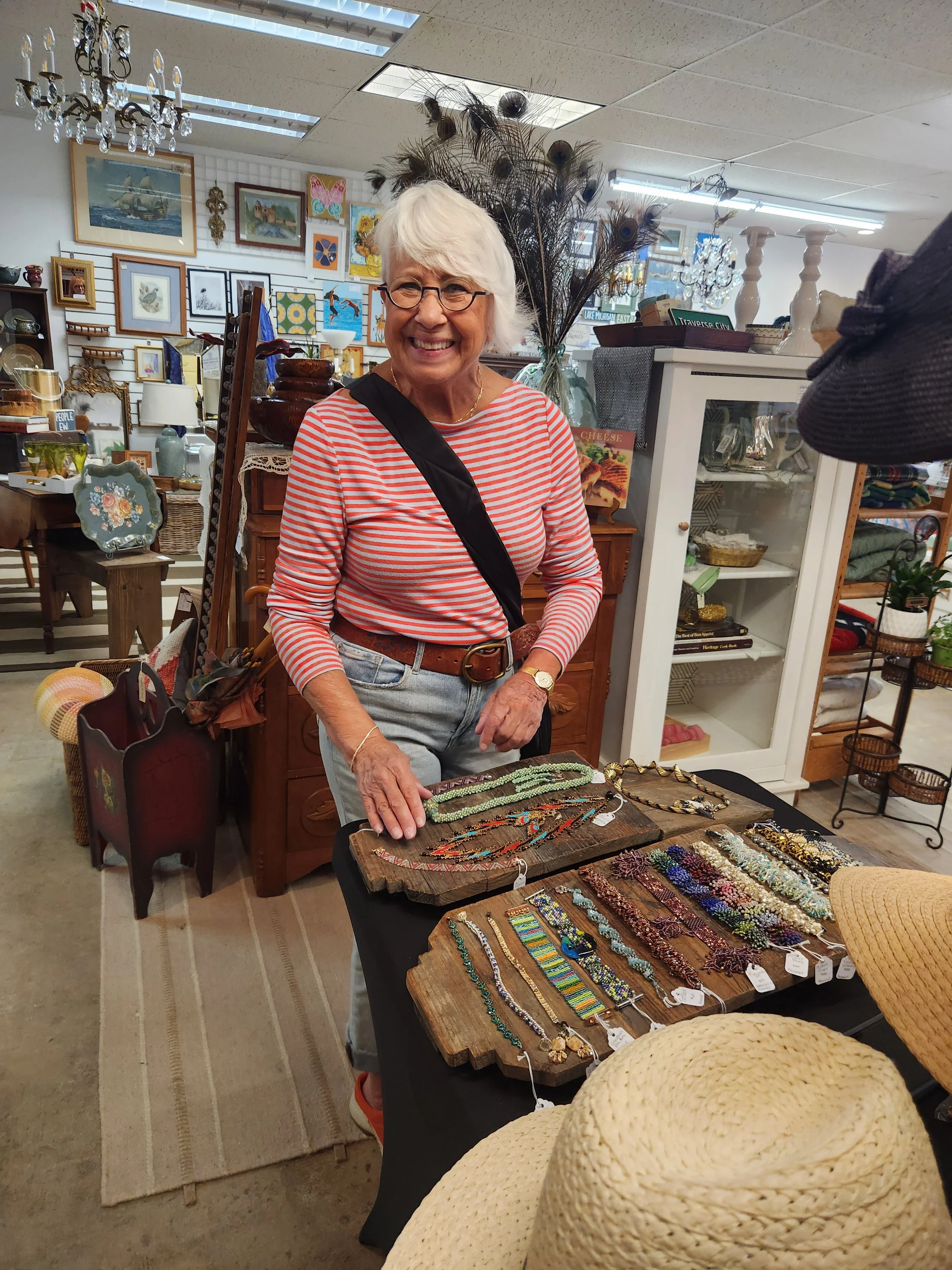 Artist Chari Ahart with examples of her jewelry by Aharts Desire