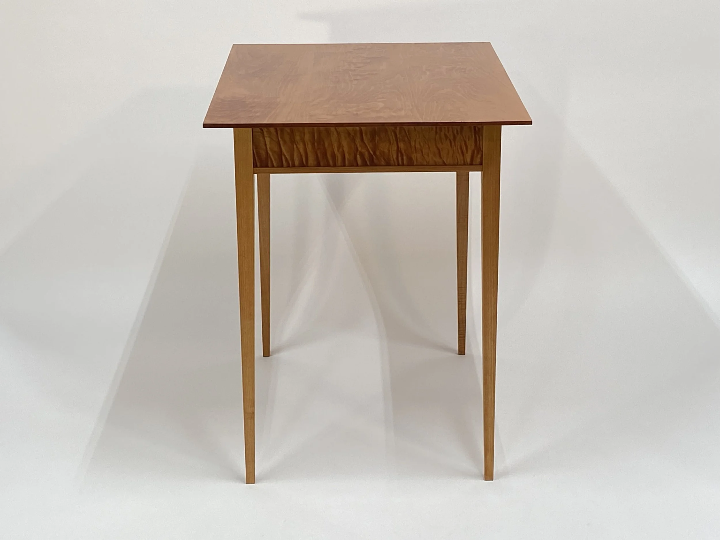 The legs taper down to a delicate profile