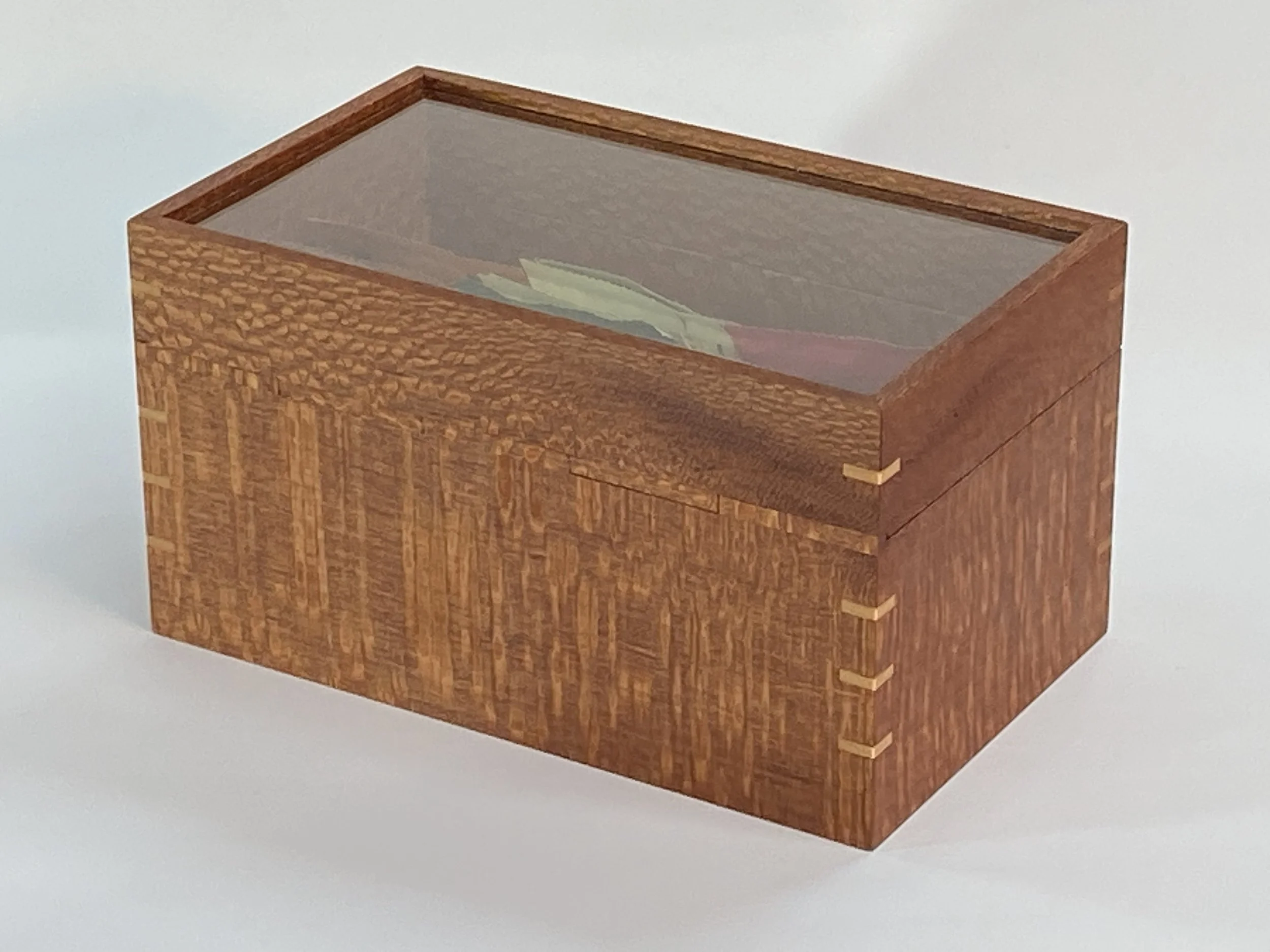 The back features a wood hinge made from Lacewood that nearly disappears into the box