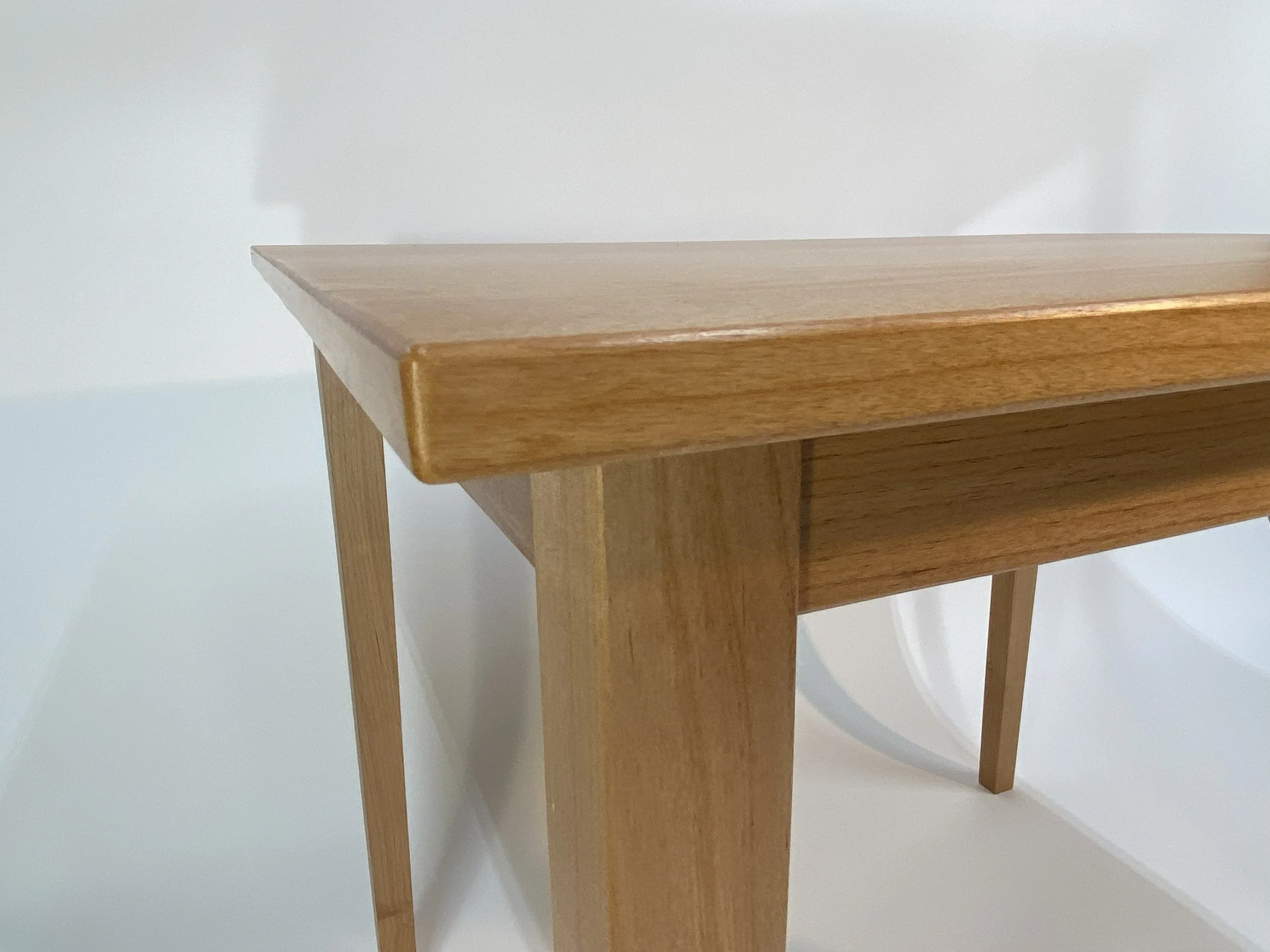 The shadow lines and tapered legs adds visual interest