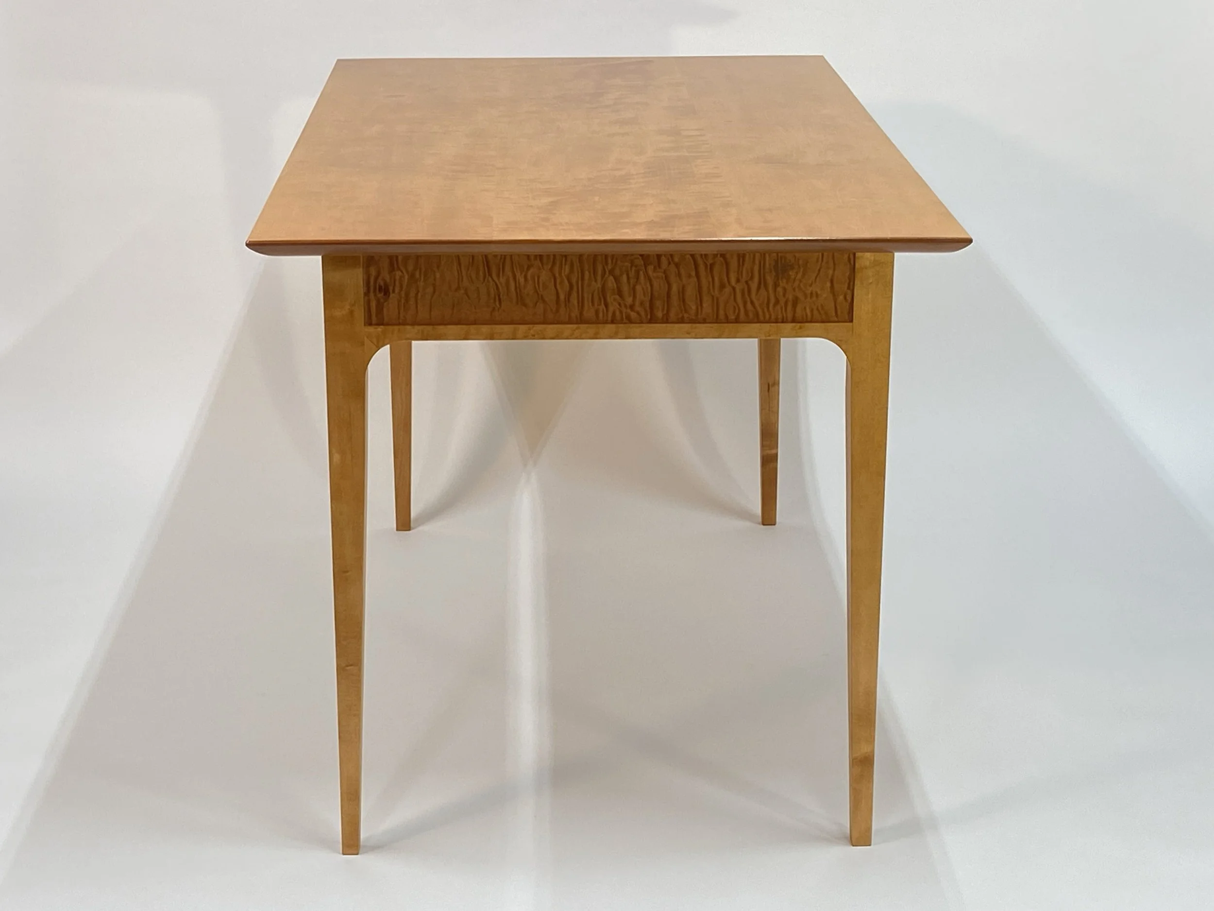 The legs taper down to a delicate profile