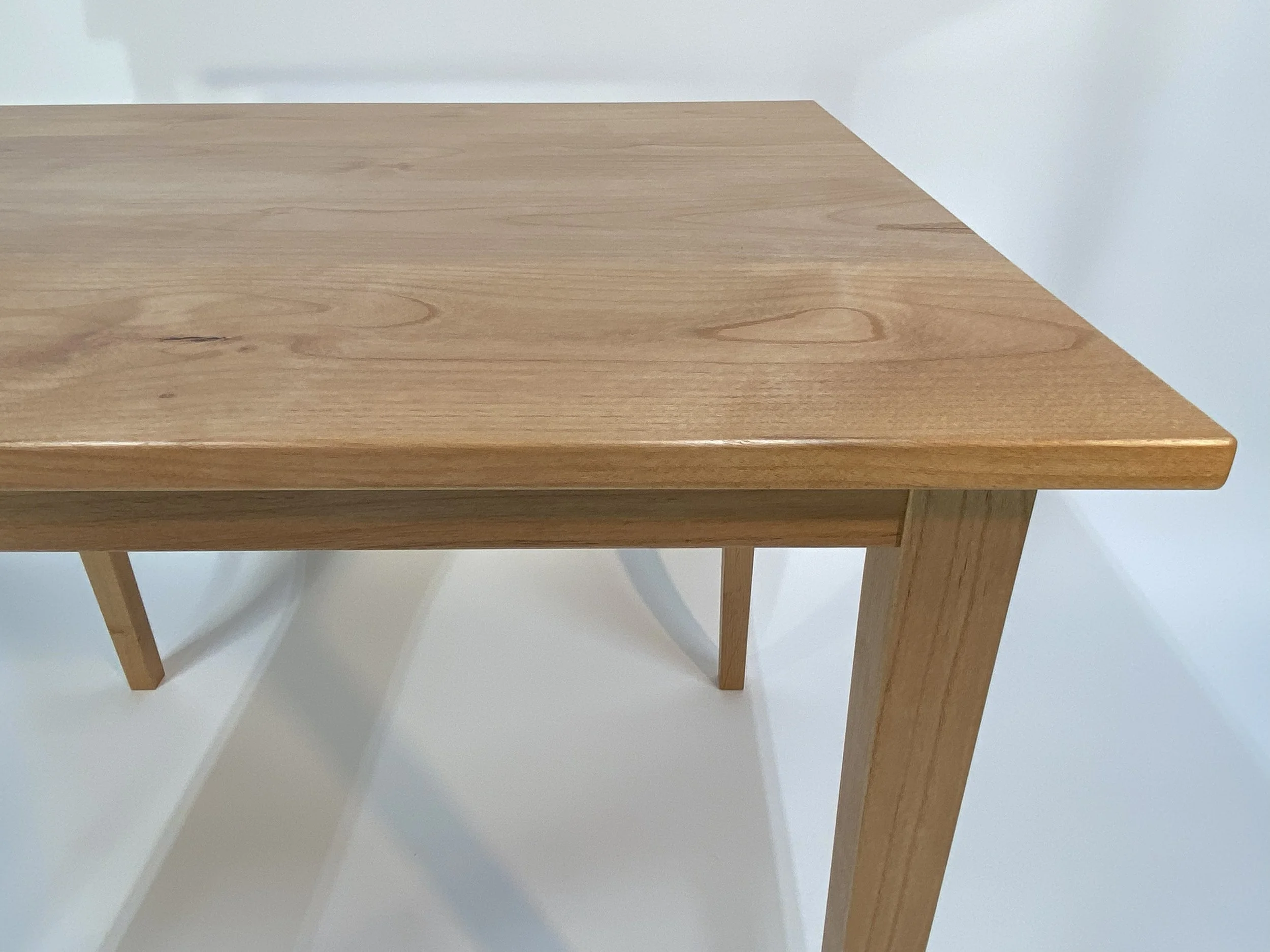 Gently rounded edges and corners soften both the visual and tactile feel of the table