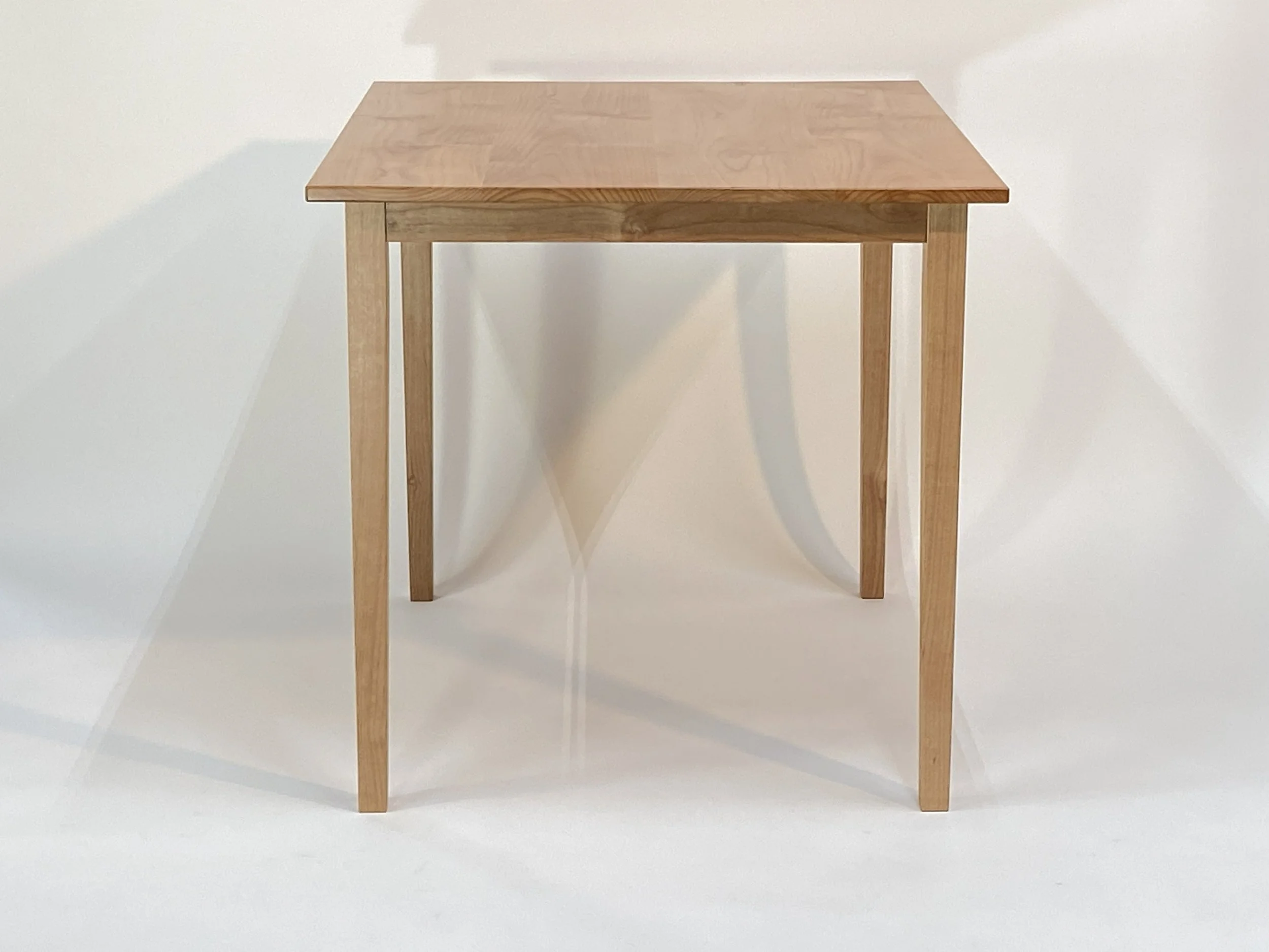 The 30" x 36" top can accommodate four for a meal
