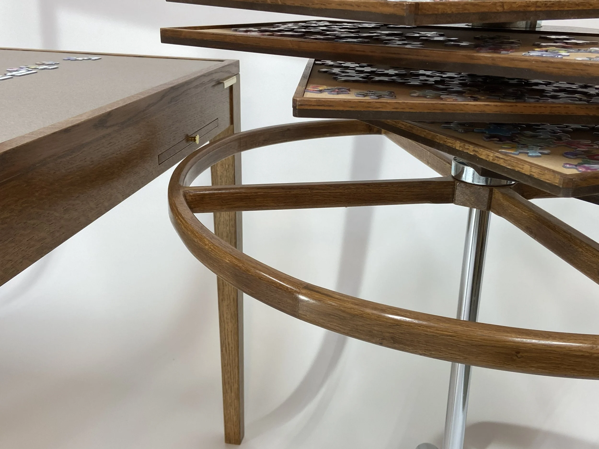 The jigsaw puzzle sorting tower has a round handle to enable rolling the tower into position.