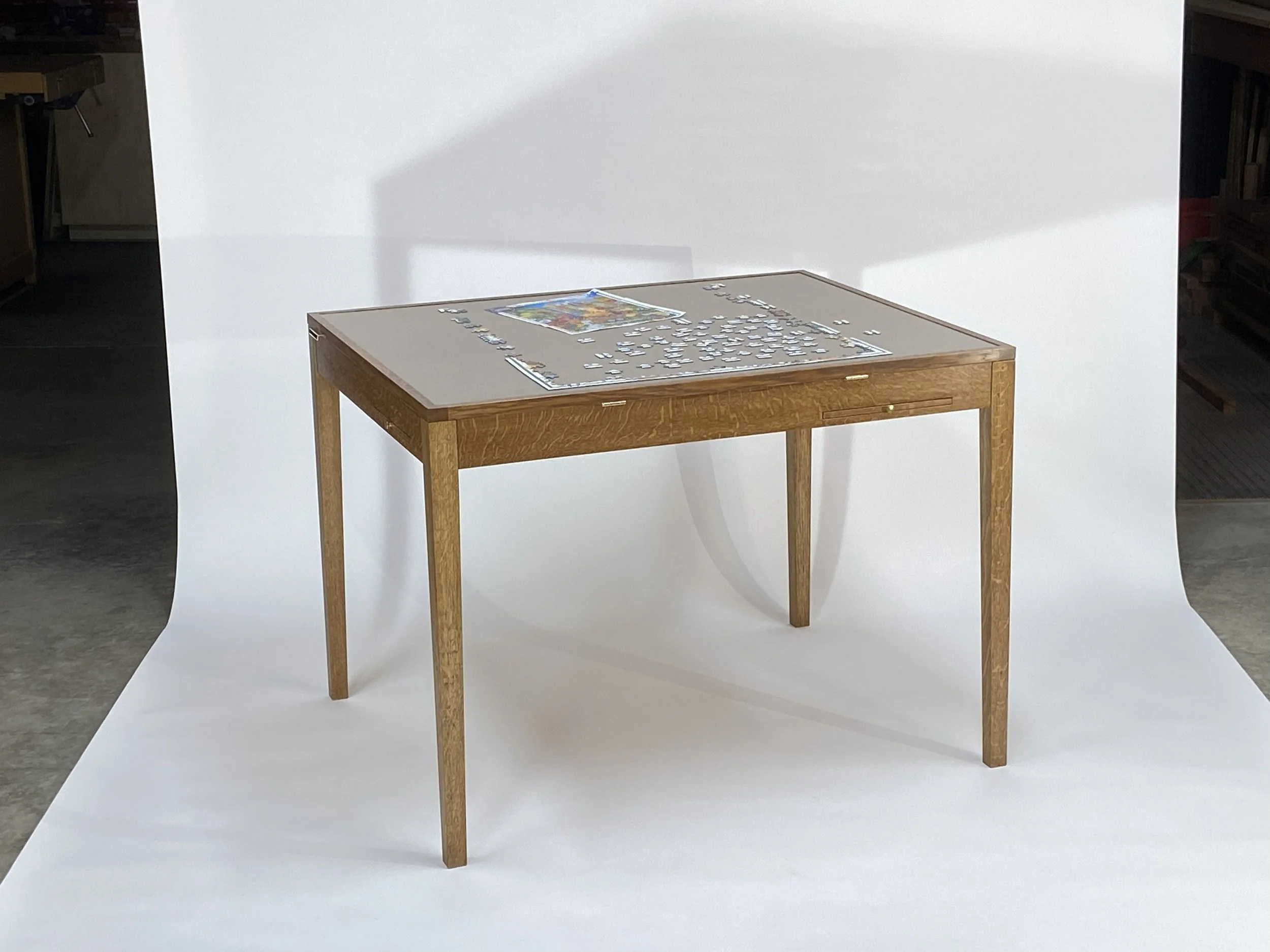 When more than one person is working on the jigsaw puzzle, the table lays flat.