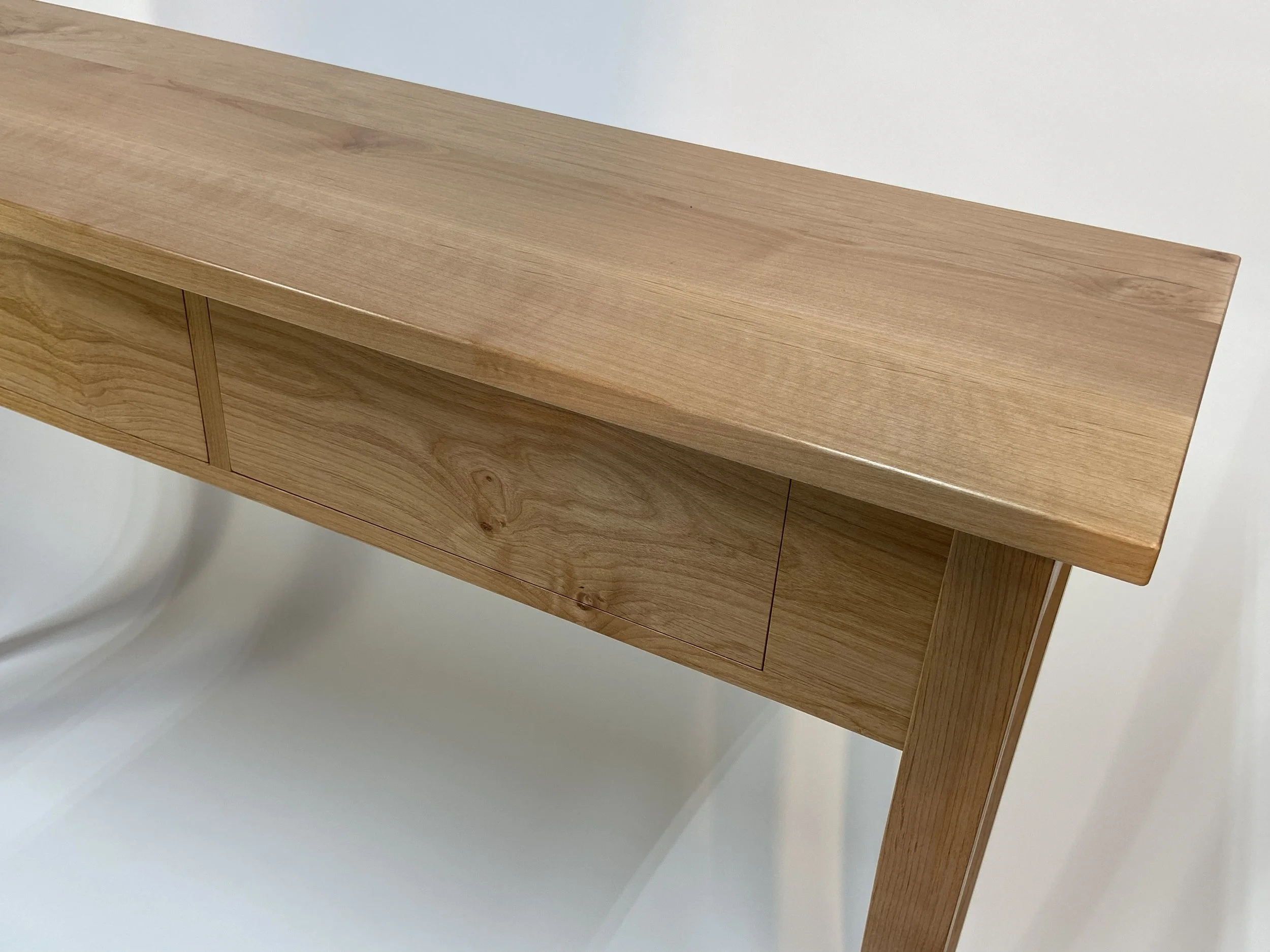 The Alder's grain and figure add interest to the drawer fronts