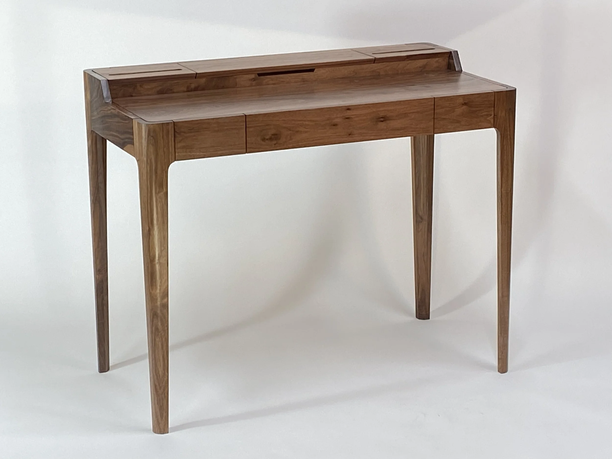 Walnut desk is 40 in. wide x 20 in. deep x 29-1/2 in. to the writing surface; 31-1/2 in. to the rear deck