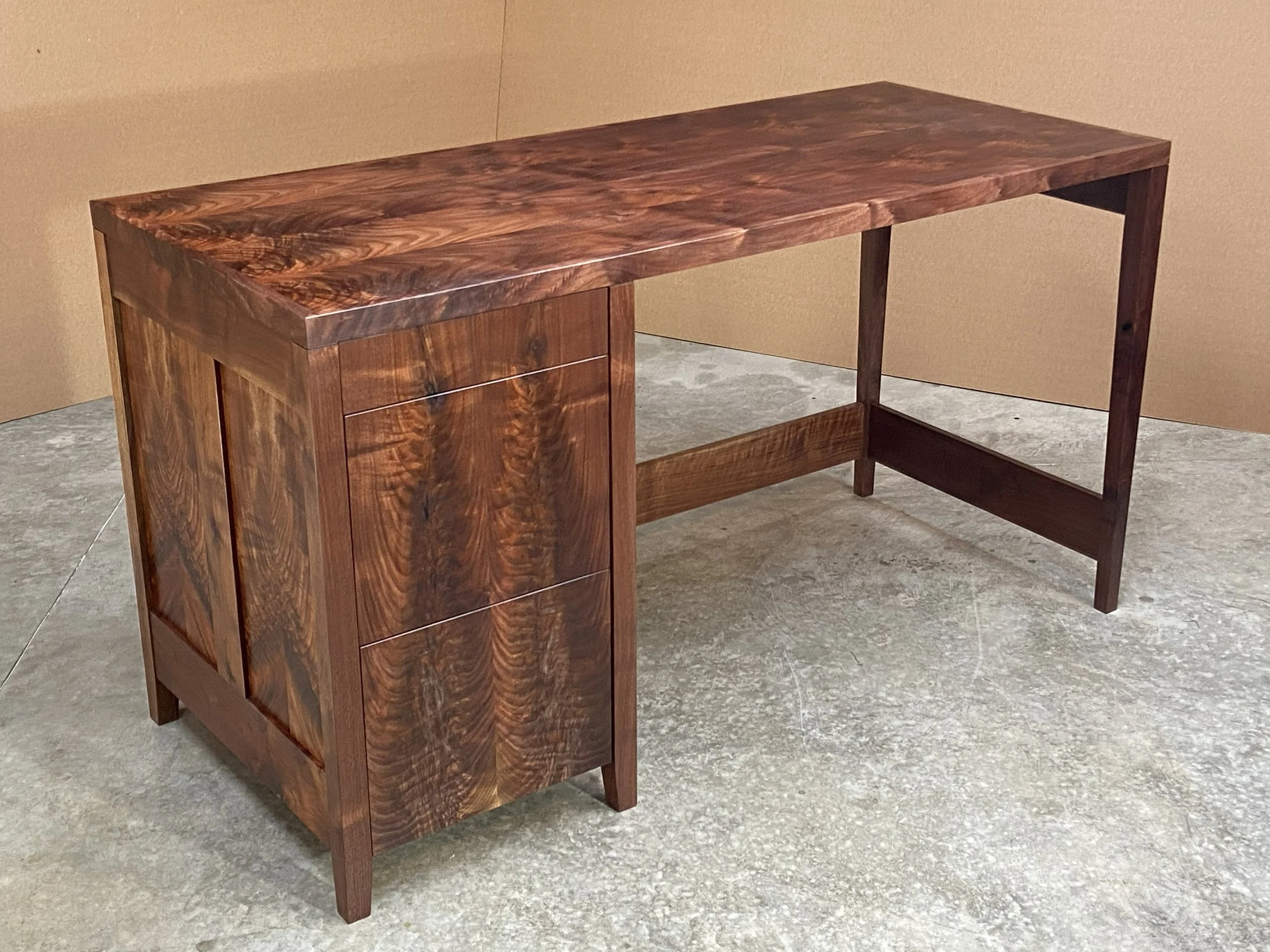 A former colleague contacted me to build him a desk for his new home in Atlanta. He liked my other designs and wanted some specific design details for his version in Walnut.