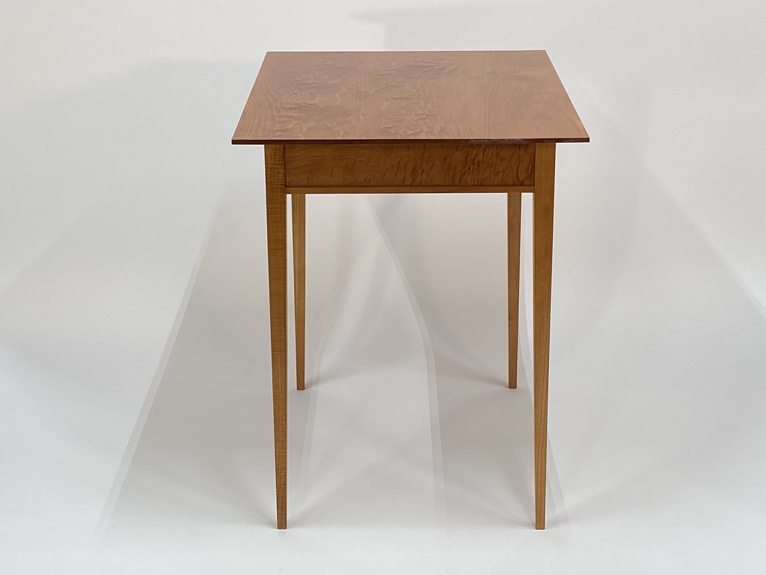 The apron features quilted Maple