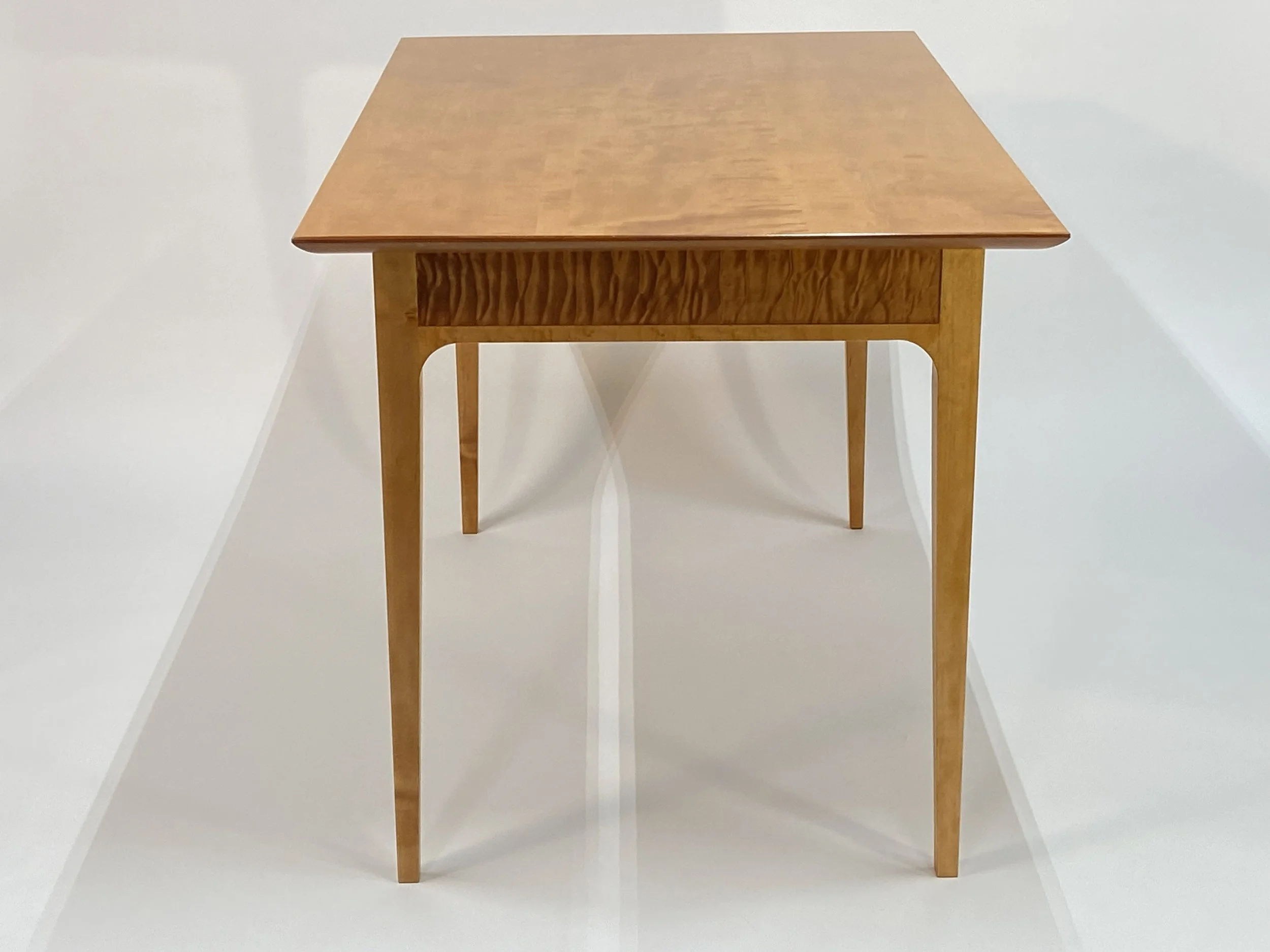 The apron features quilted Maple