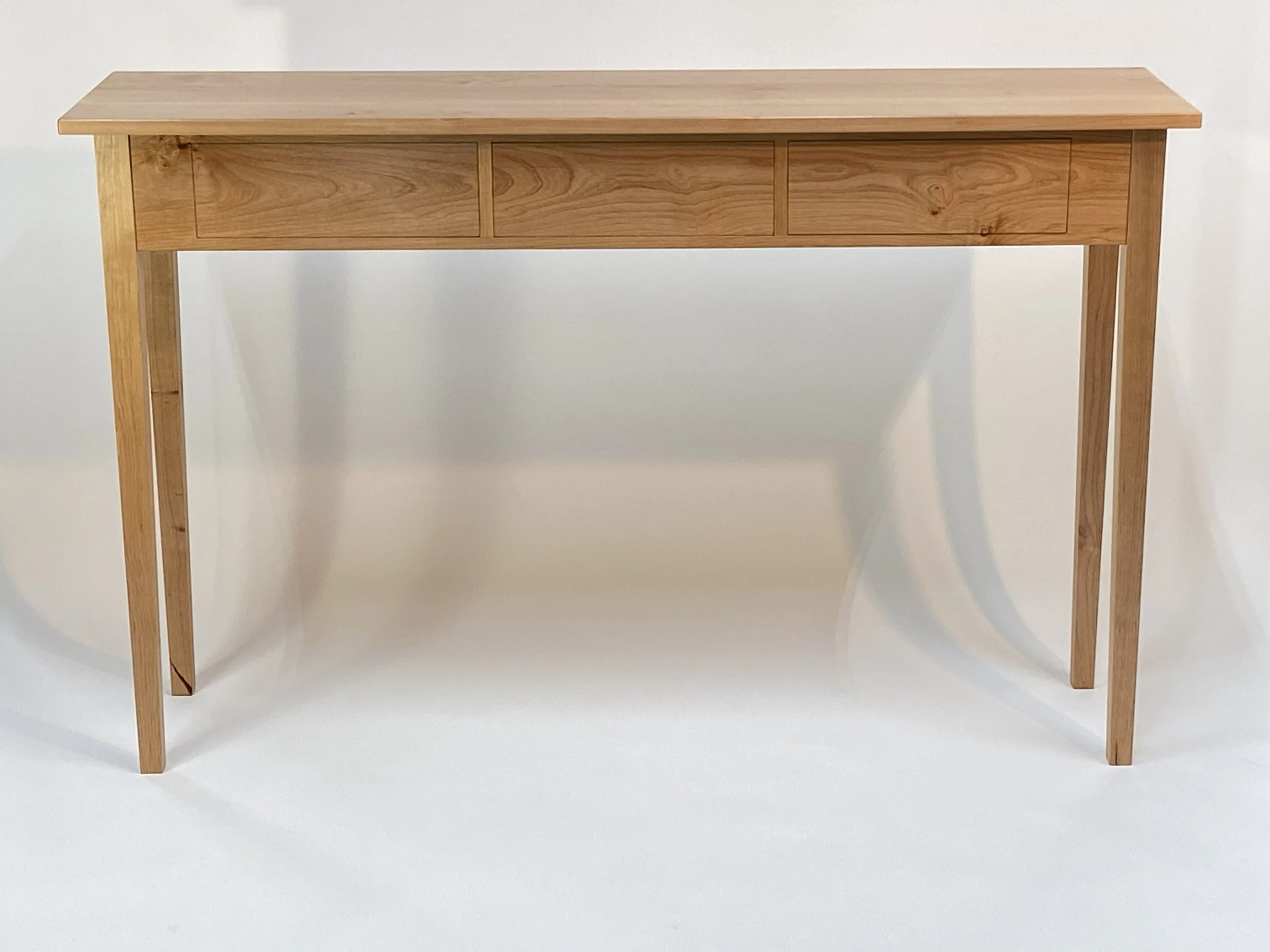 The drawer fronts have continuous grain match across the front