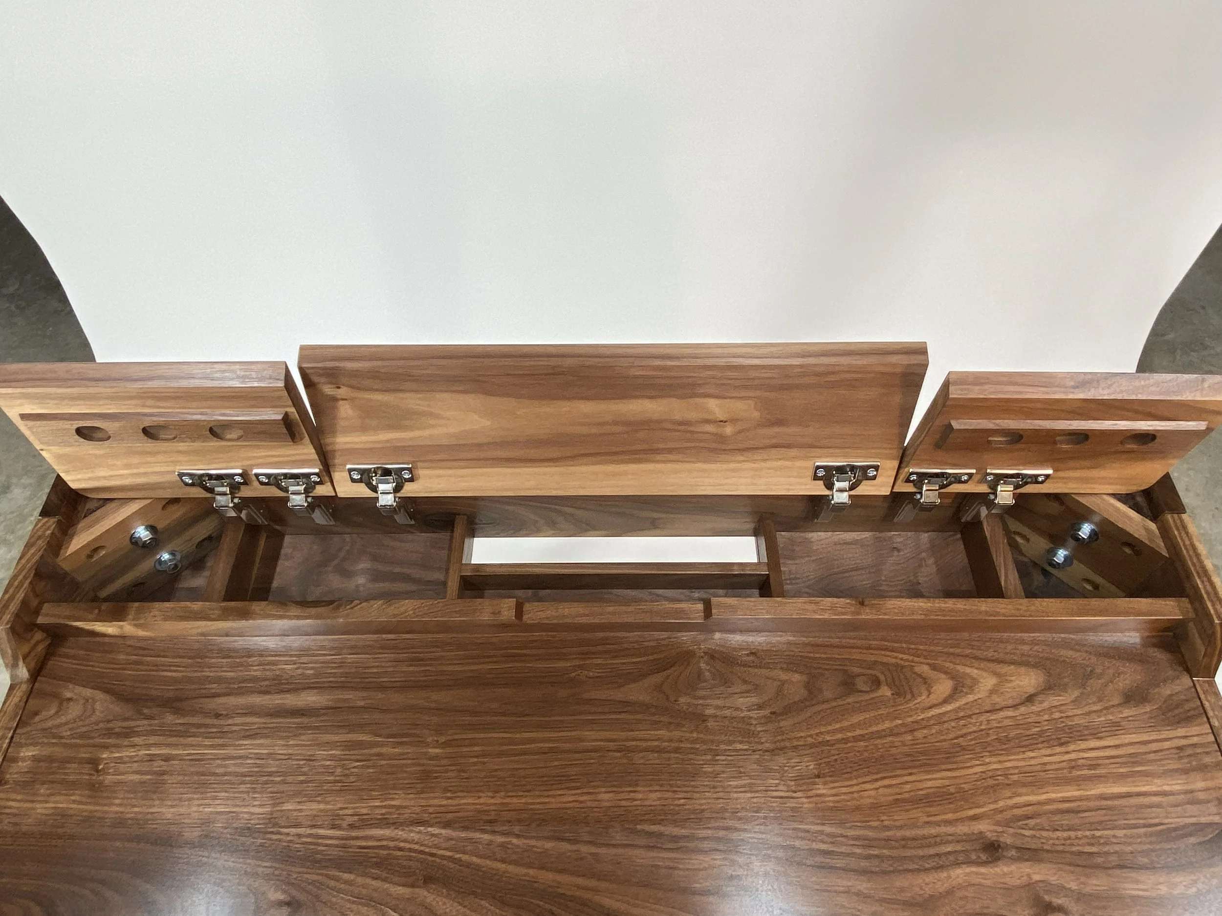 The rear storage compartment allows you a place for power supplies and cords, plus a pass-through to a wall outlet