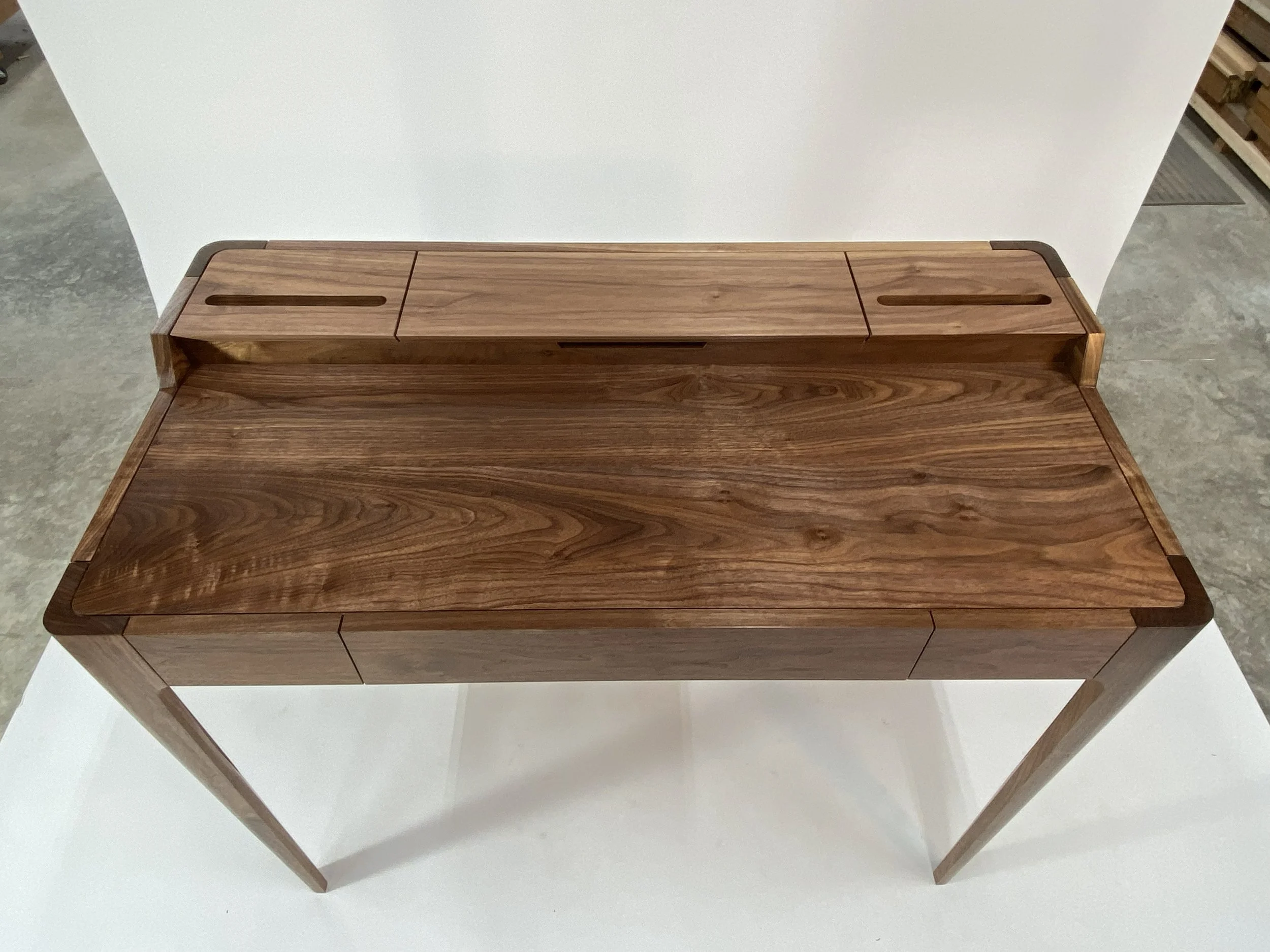 The writing surface has beautiful color and figure