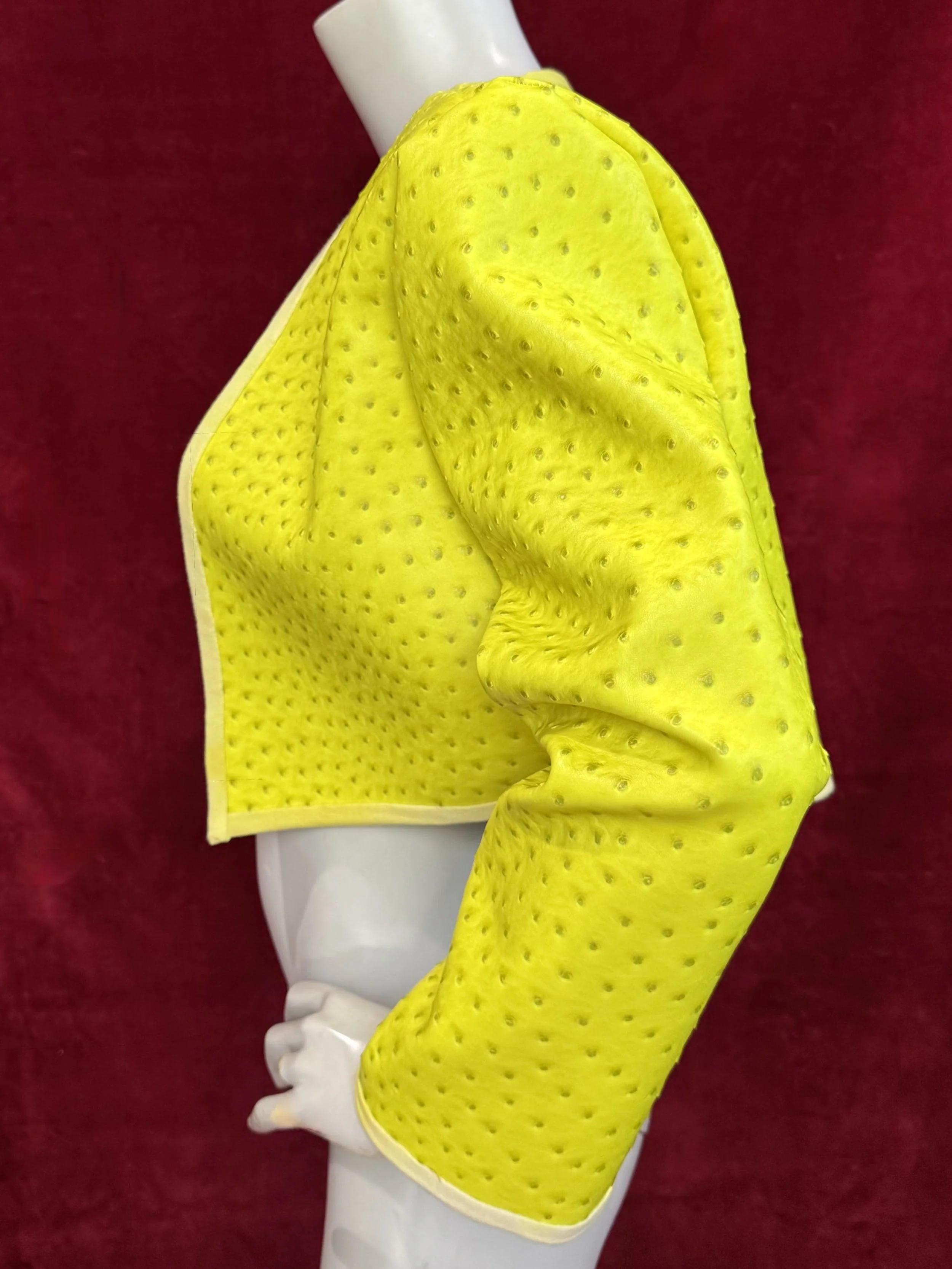 neon chartreuse faux ostrich skin cropped jacket with strong shoulder silhouette