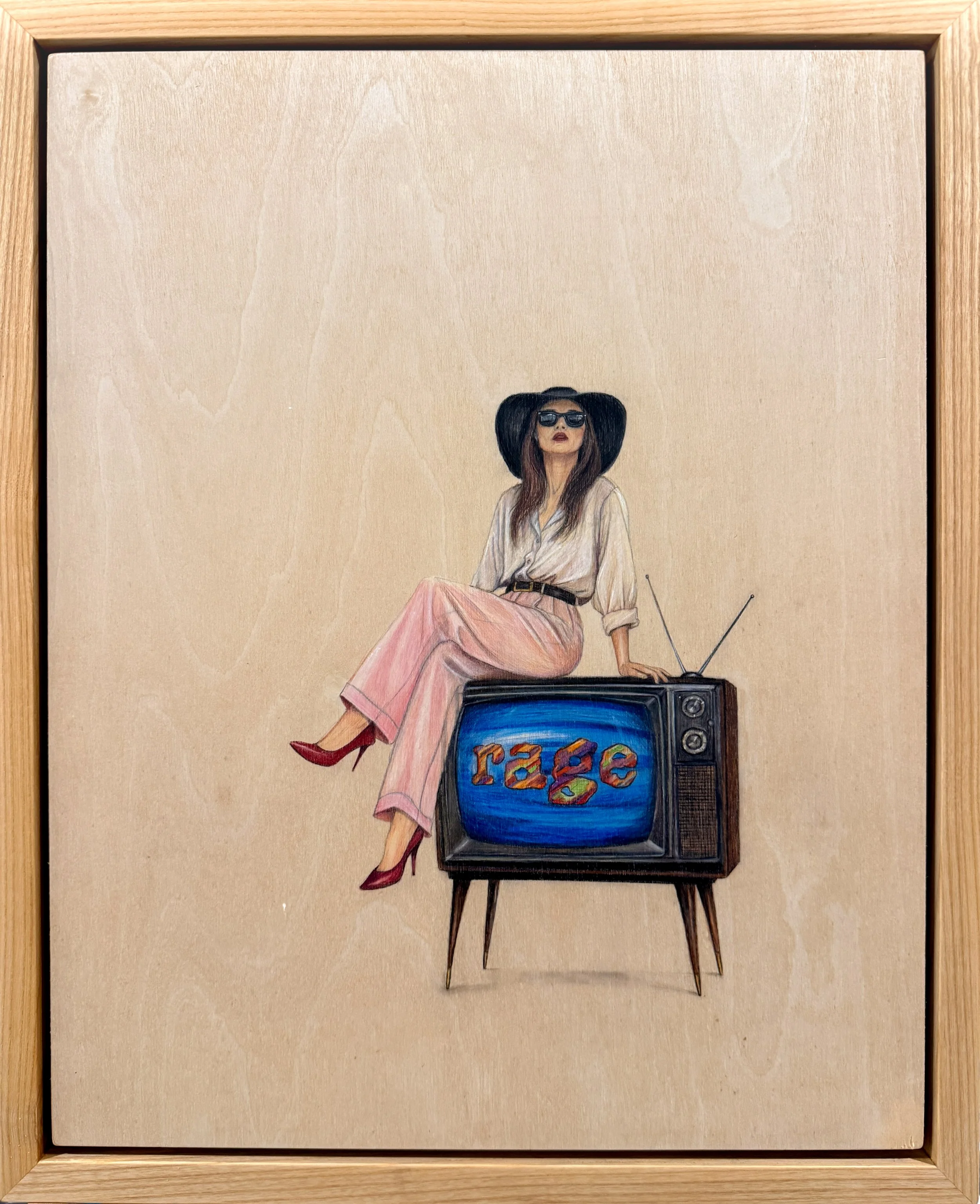 Saturday Mornings by Shanay Manitzky, showing a woman seated on a vintage television displaying RAGE.
