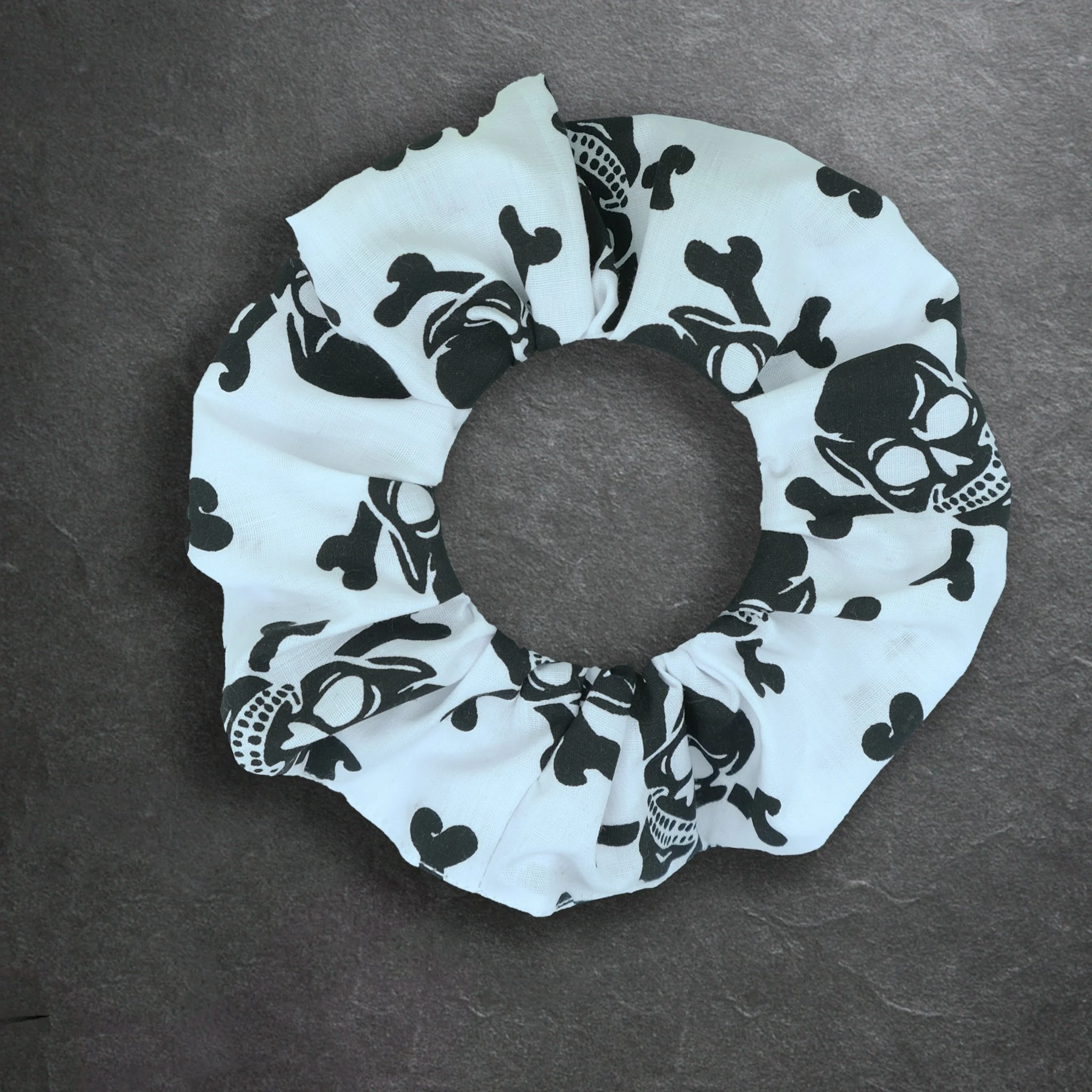 White Axis Range scrunchie with black skulls, handmade gothic hair accessory by Creatoria Nyx
