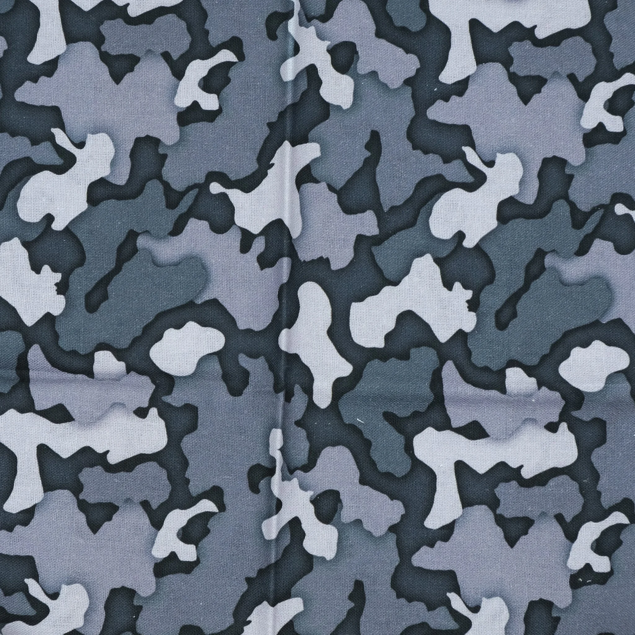 Fabric close up showing camo print on grey background, used for handmade Axis Range scrunchie by Creatoria Nyx