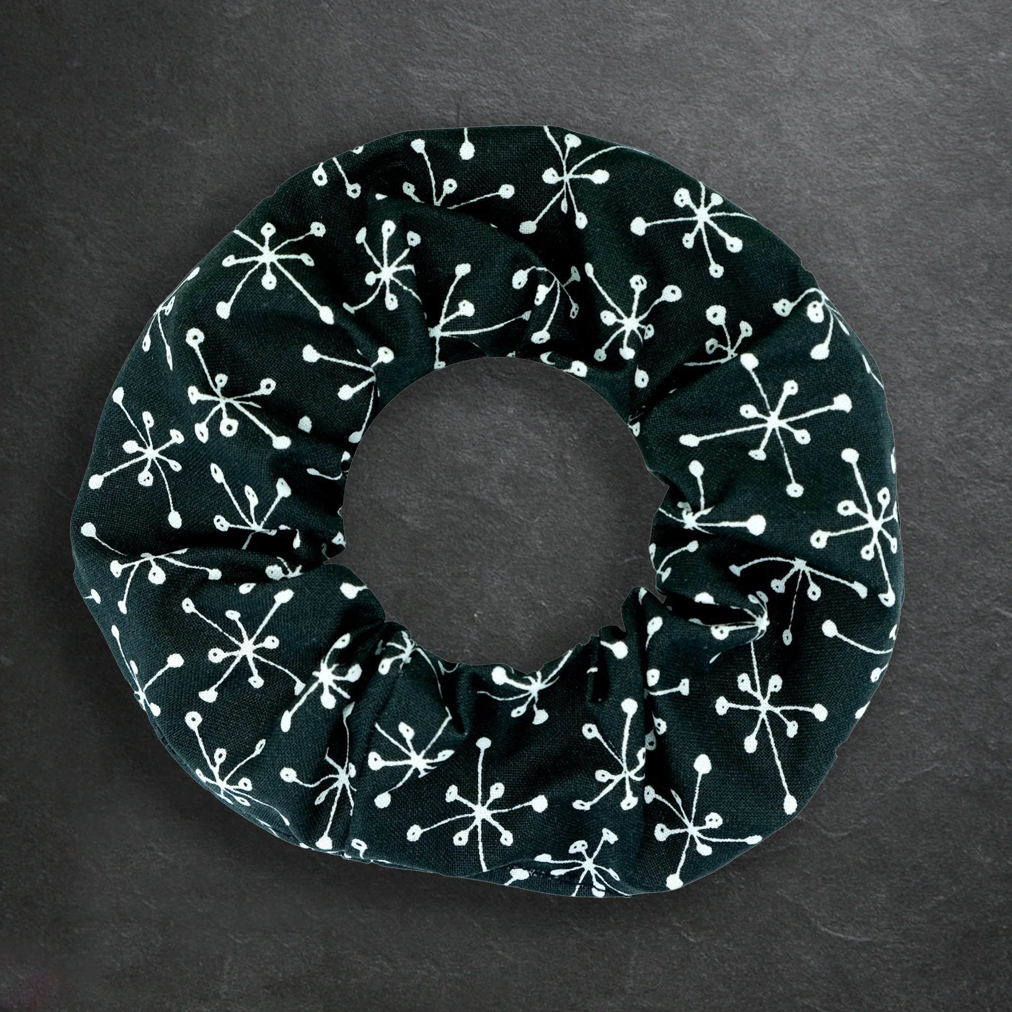 Black Axis Range scrunchie with white atomic starburst pattern, handmade alternative hair accessory by Creatoria Nyx