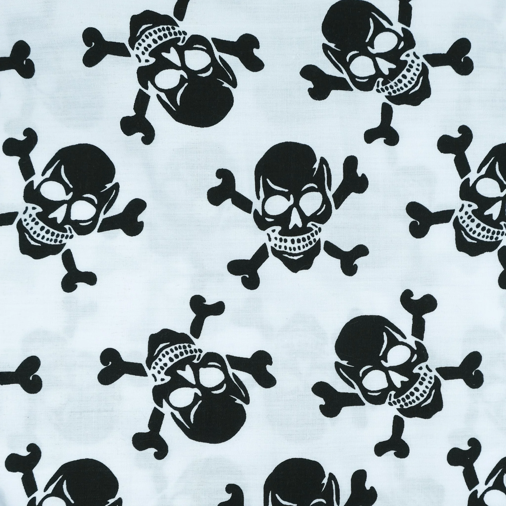White fabric with black skulls, used for handmade Axis Range scrunchie by Creatoria Nyx