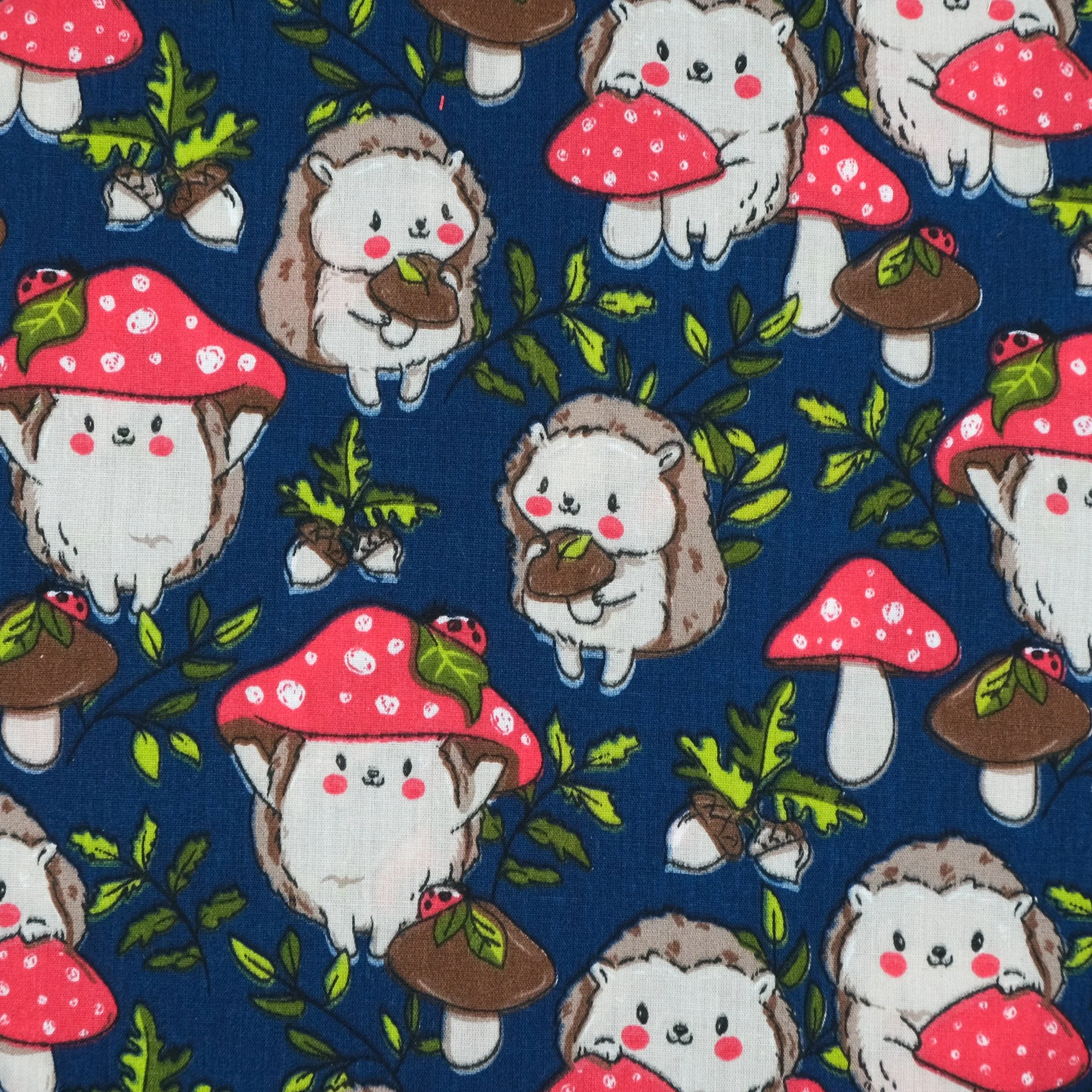 Dark blue fabric with hedgehogs and toadstools, used for handmade Axis Range scrunchie by Creatoria Nyx